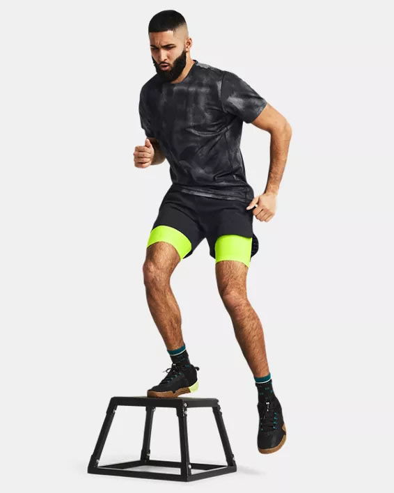 Muhammad Abbasi | Active | Black tie-dye t-shirt, neon green compression shorts, black shorts, performing step-ups on plyometric box