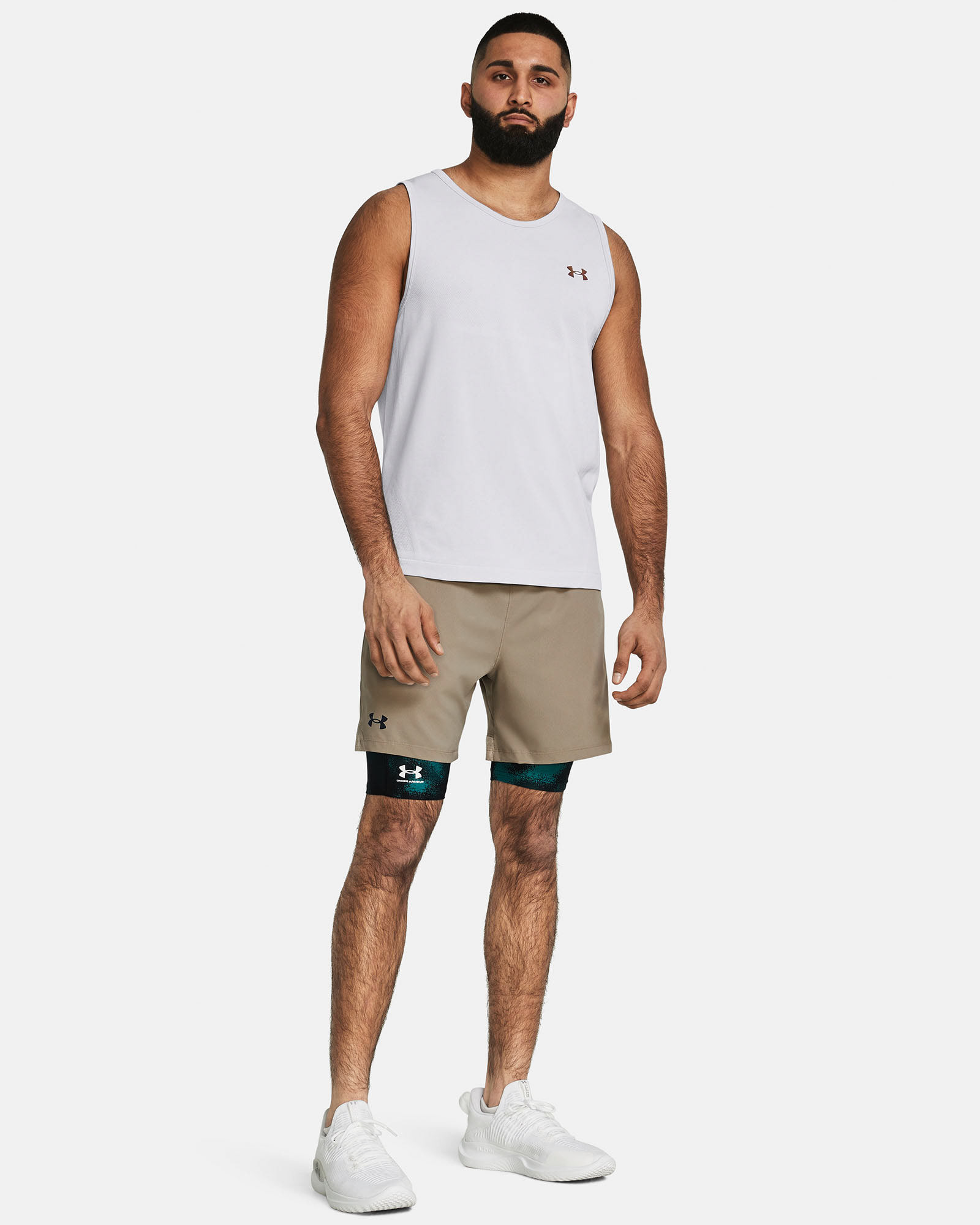Muhammad Abbasi | Under Armour | Ecom Shoot | White sleeveless training tank with beige shorts and green lining