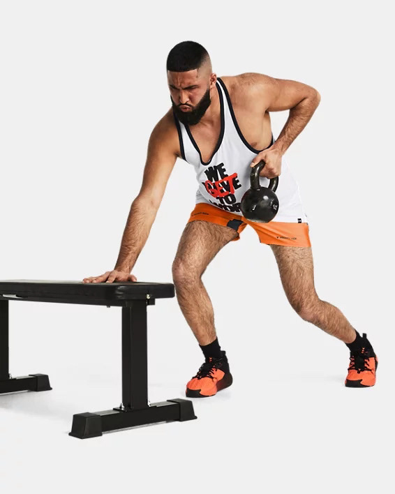Muhammad Abbasi | Active | White graphic tank top, orange shorts, bent-over kettlebell row using bench