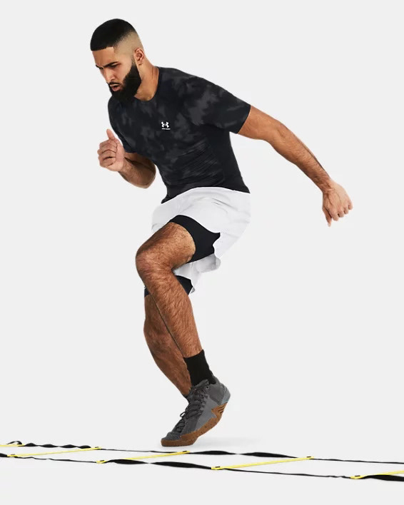 Muhammad Abbasi | Active | Black Under Armour t-shirt, white shorts, running agility ladder drill