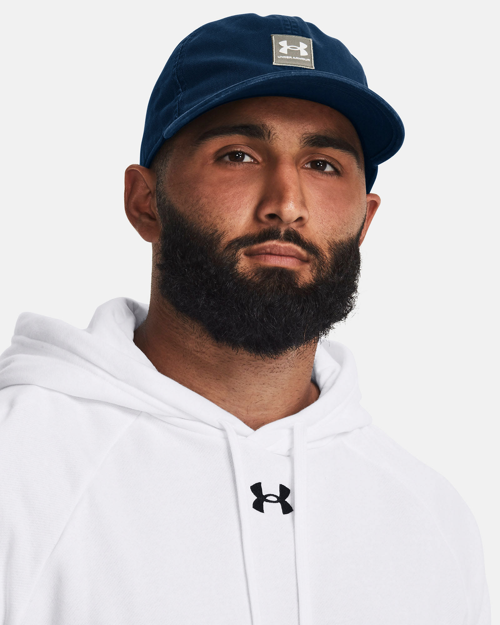Muhammad Abbasi | Under Armour | Hats & Accessories | Navy hat with square UA logo, white hoodie