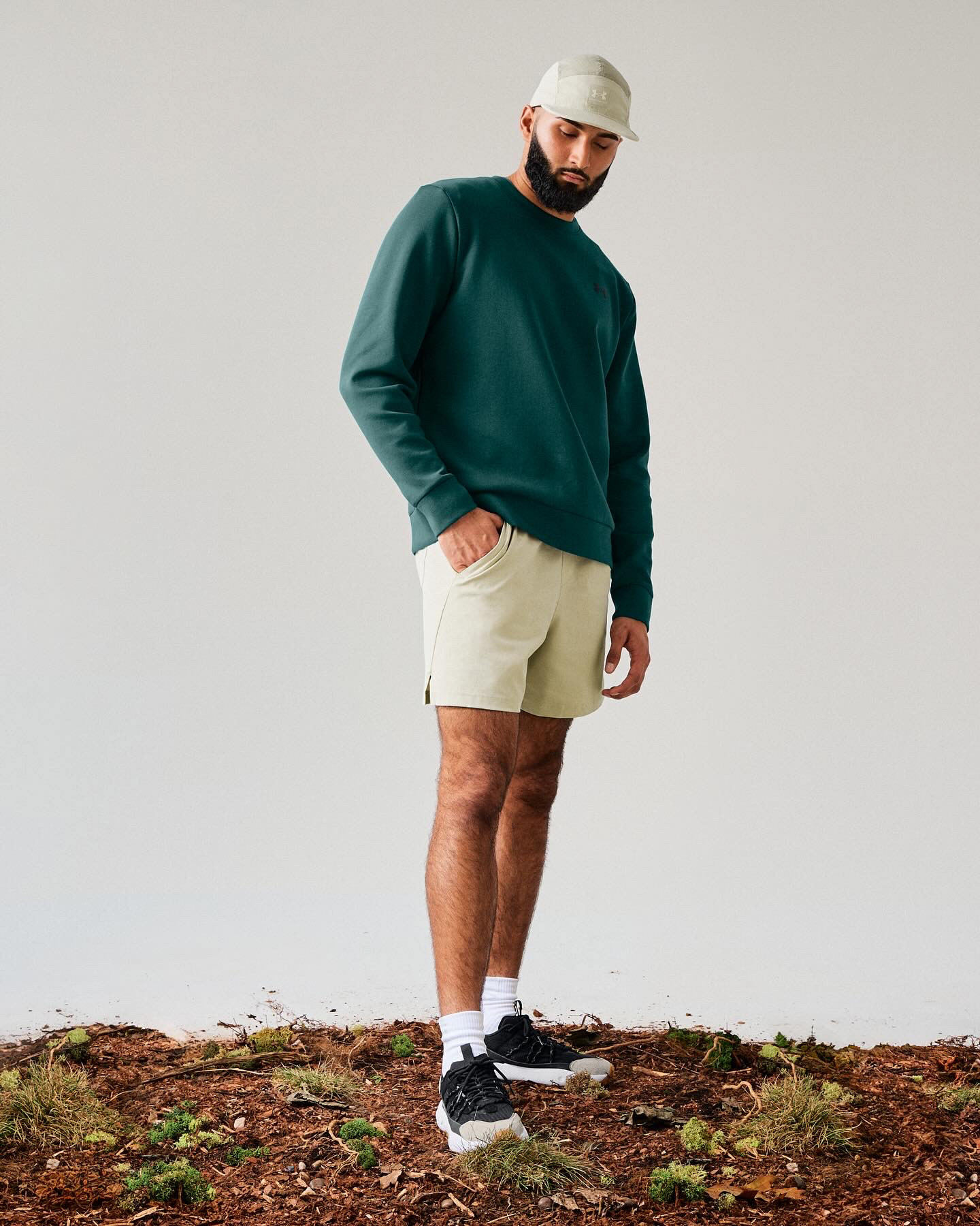 Muhammad Abbasi | Under Armour | Fat Tire Venture Pro | Standing in green crewneck and tan shorts
