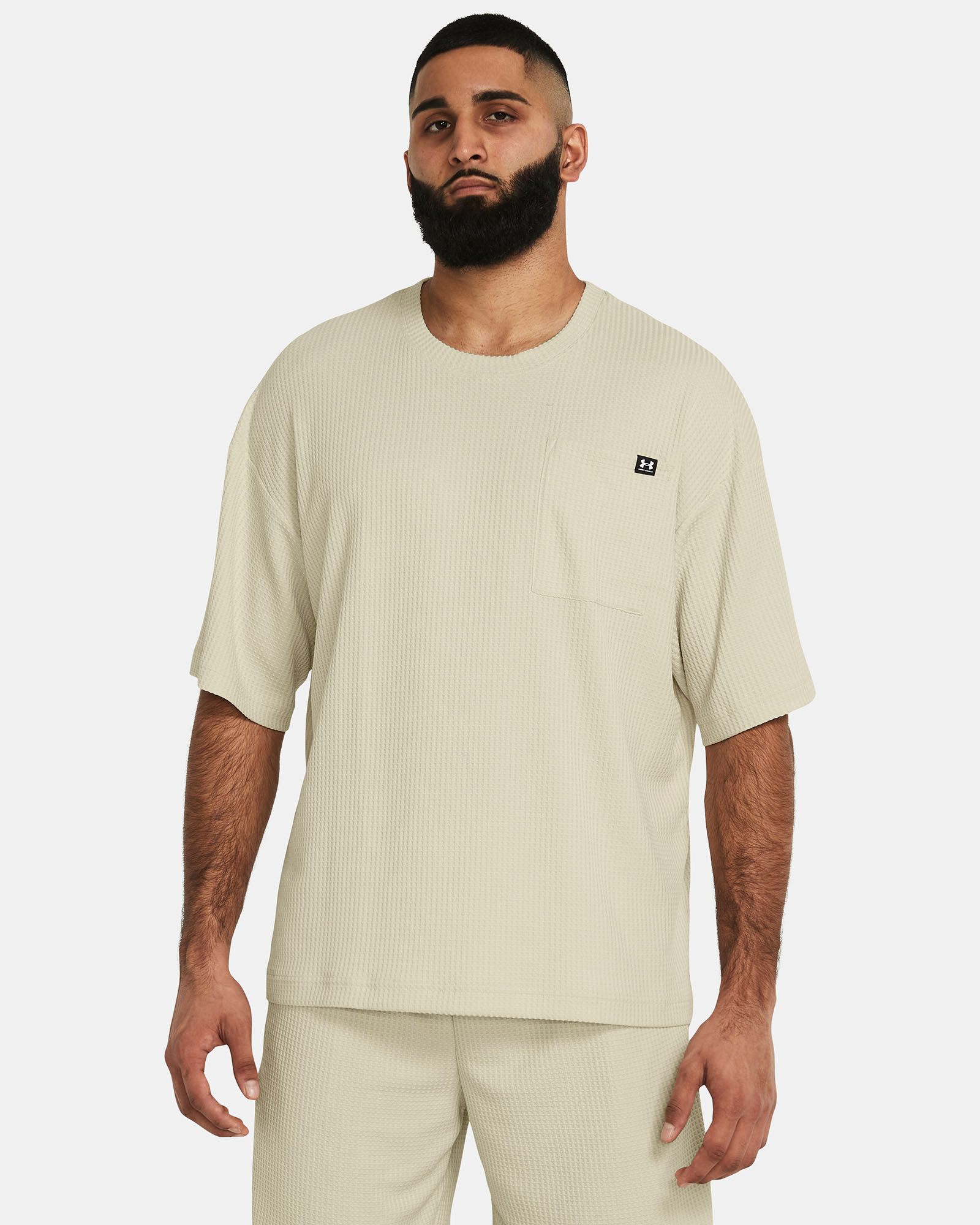 Muhammad Abbasi | Under Armour | Ecom Shoot | Beige oversized short-sleeve top