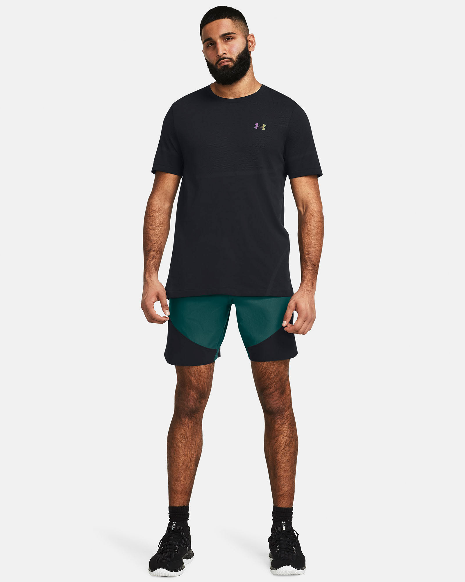 Muhammad Abbasi | Under Armour | Ecom Shoot | Black short-sleeve tee with teal shorts