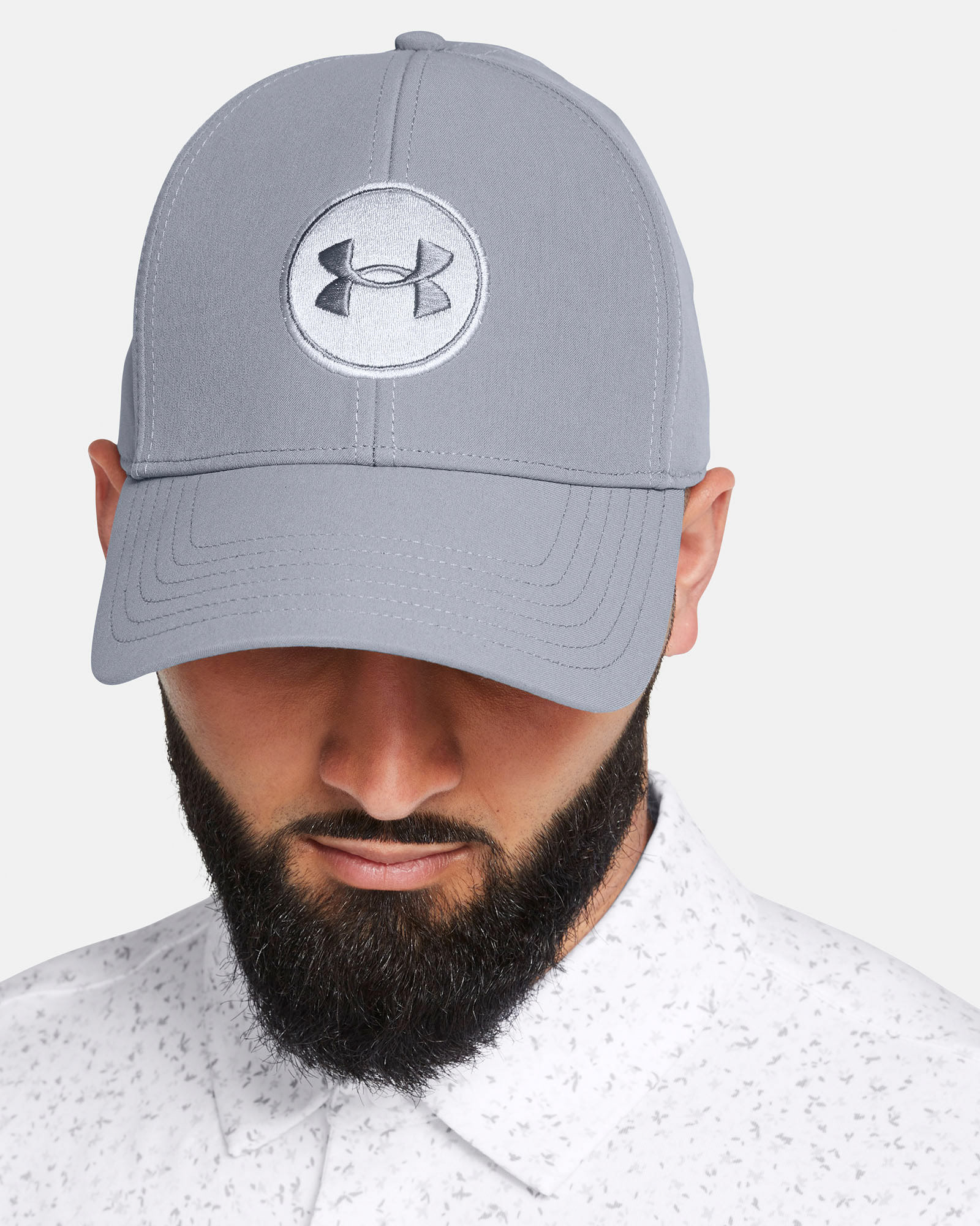 Muhammad Abbasi | Under Armour | Hats & Accessories | Light grey hat with UA logo, white patterned button-up shirt