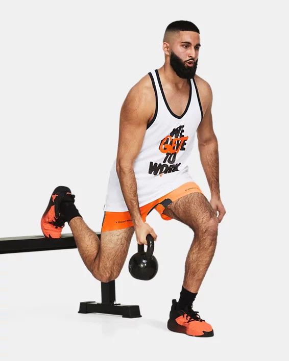 Muhammad Abbasi | Active | White graphic tank top, orange shorts, Bulgarian split squat holding kettlebell