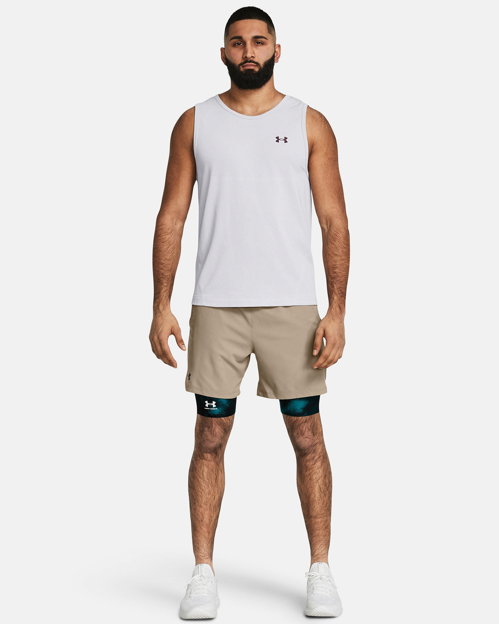 Muhammad Abbasi | Under Armour | Ecom Shoot | White sleeveless tank with beige shorts