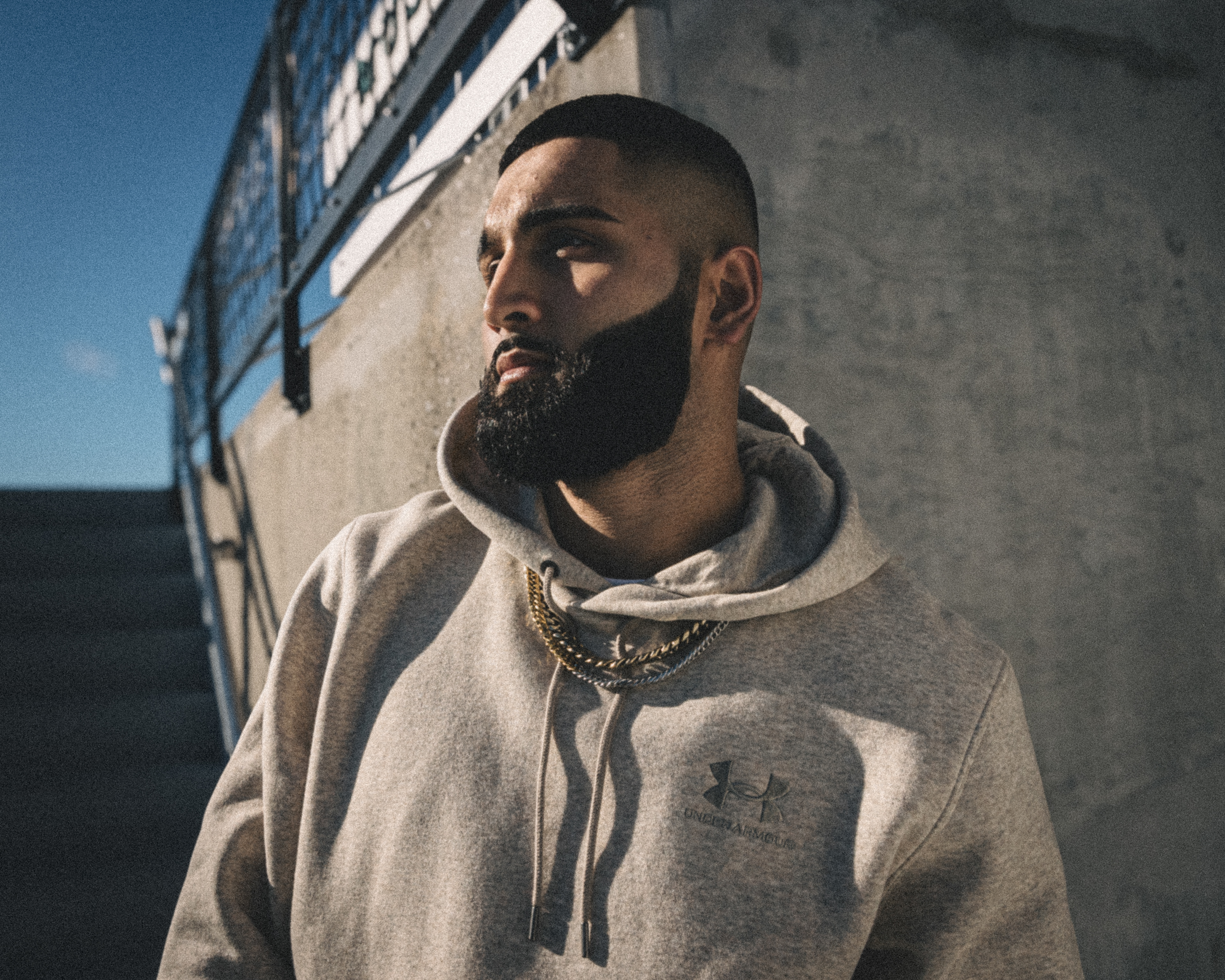 Muhammad Abbasi | Under Armour | ICON Fleece Hoodie | Gazing Away in Sunlight at Stadium