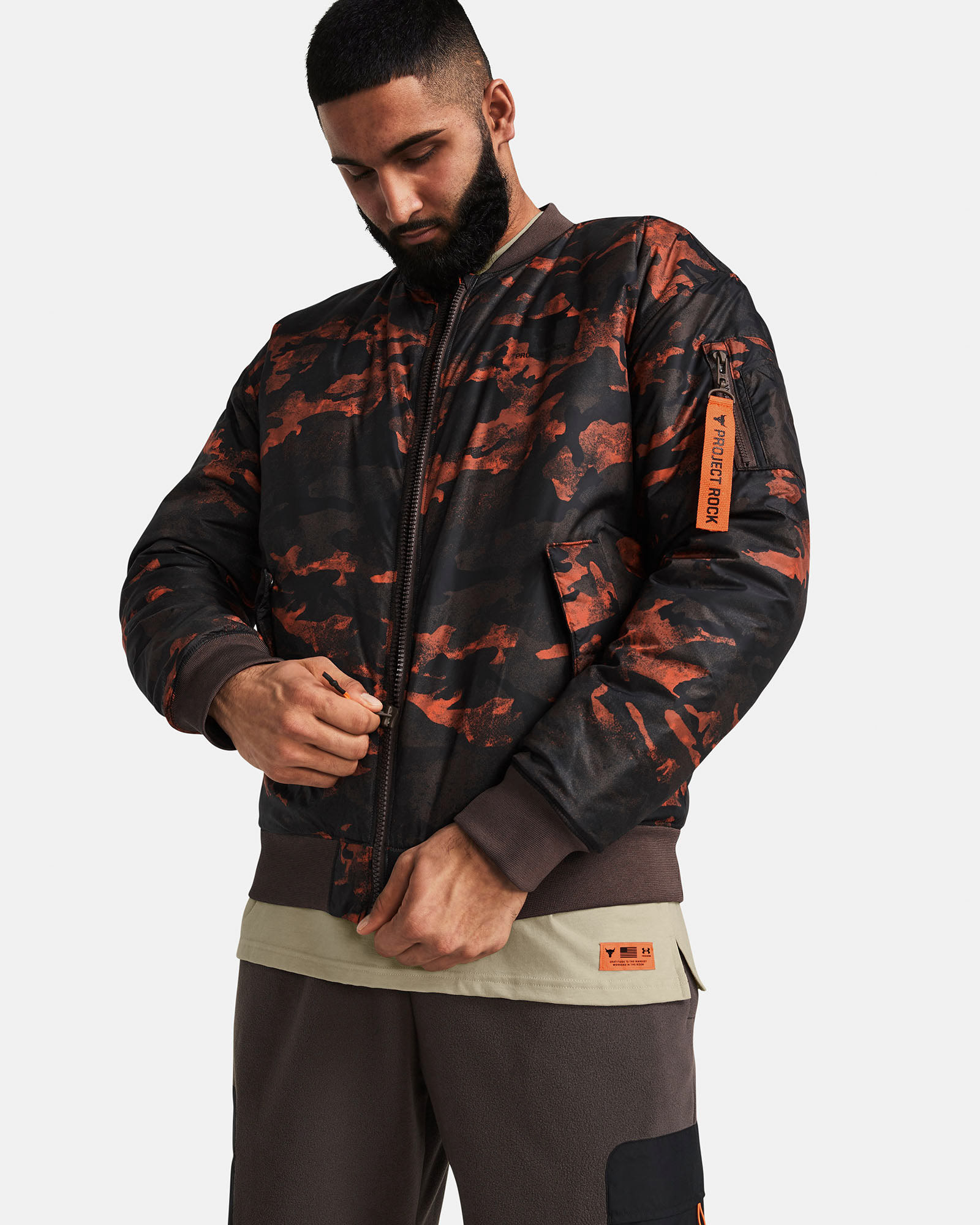 Muhammad Abbasi | Under Armour | Ecom Shoot | Red and black camo Project Rock jacket