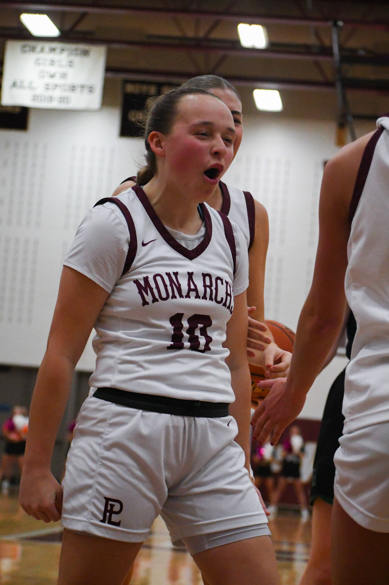 Kamira Botos celebrates an "and-one" after Rease Murtaugh's made layup