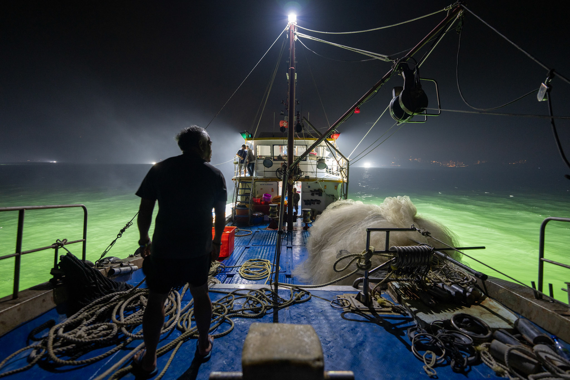 On a two day overnight fishing trip we follow one boat going out to fish off Lamma Island overnight and return to sell the fish in the Aberdeen fish market. 21/5/2022, Aberdeen, Hong Kong, China.