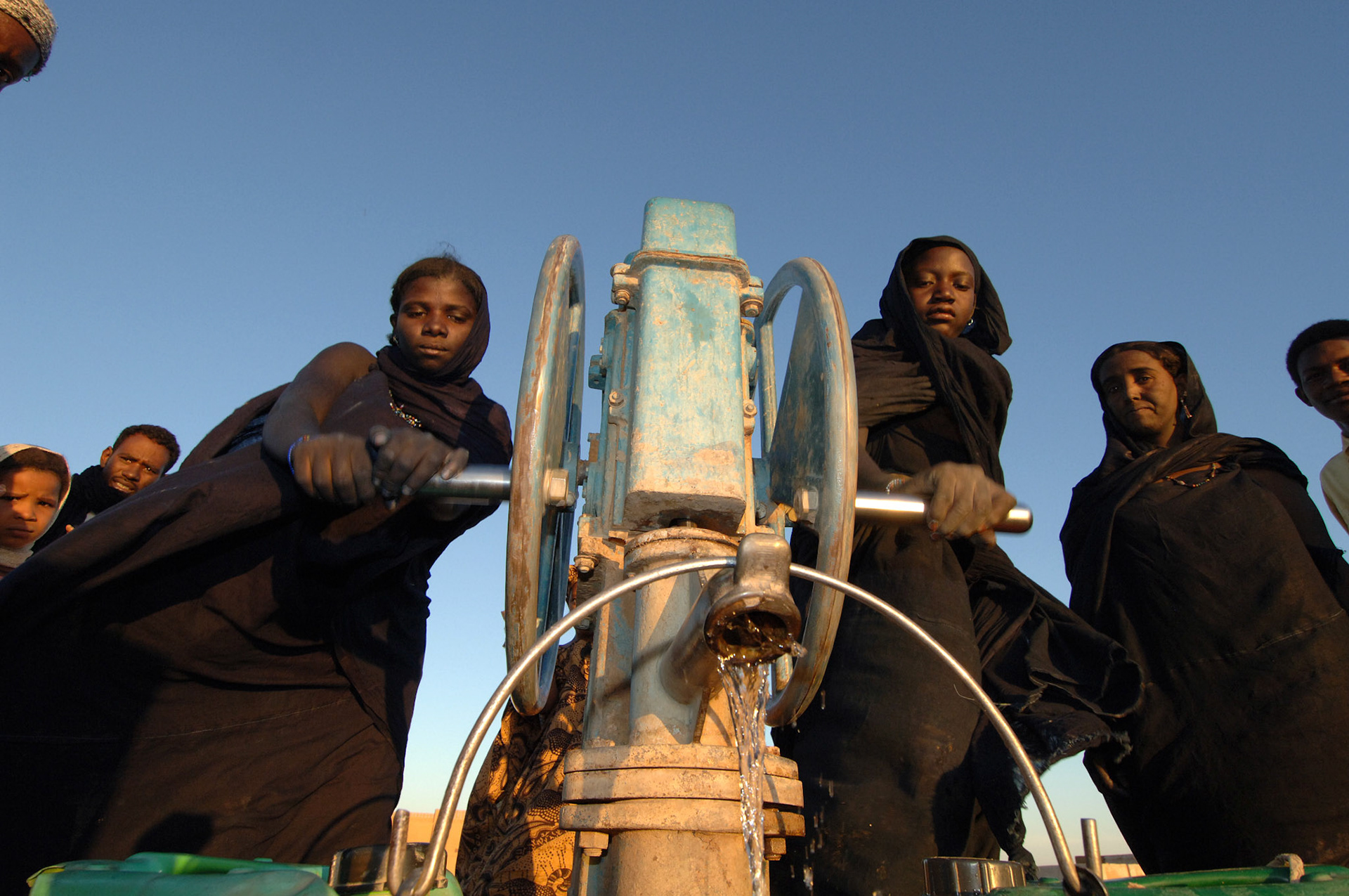 Pumping water for planting and maintaining small vegetable gardens, Oxfam projects undertaken by local NGO ADEHSAH in  Almoustrat village, Borem District, Mali, November 2005