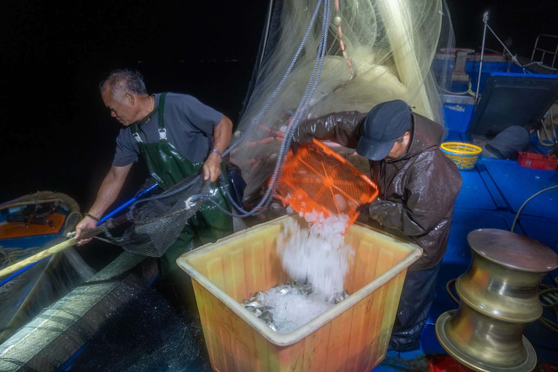 On a two day overnight fishing trip we follow one boat going out to fish off Lamma Island overnight and return to sell the fish in the Aberdeen fish market. 22/5/2022, Aberdeen, Hong Kong, China.