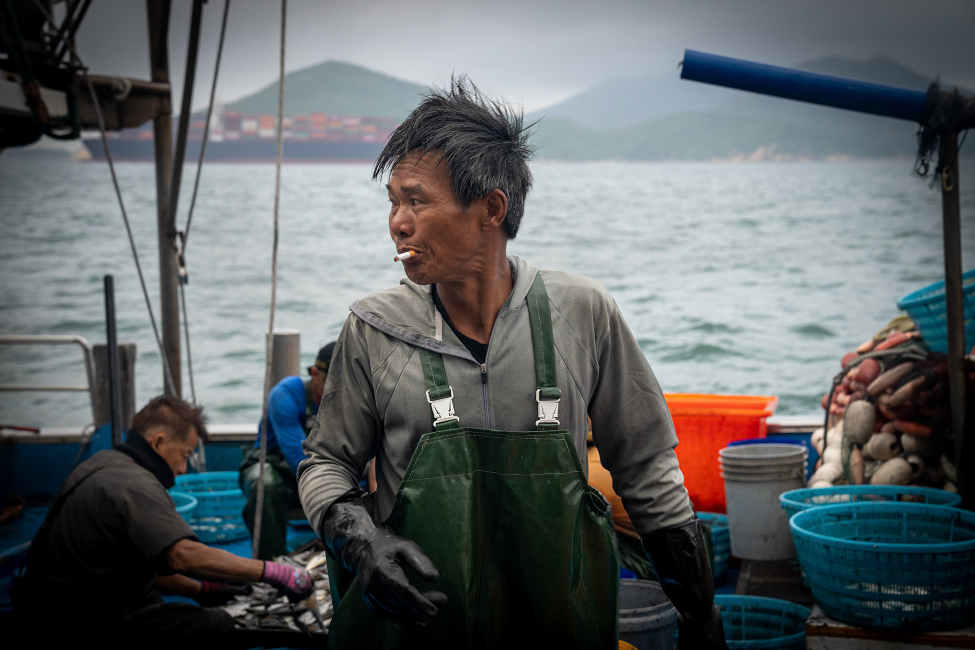 On a two day overnight fishing trip we follow one boat going out to fish off Lamma Island overnight and return to sell the fish in the Aberdeen fish market. 22/5/2022, Aberdeen, Hong Kong, China.