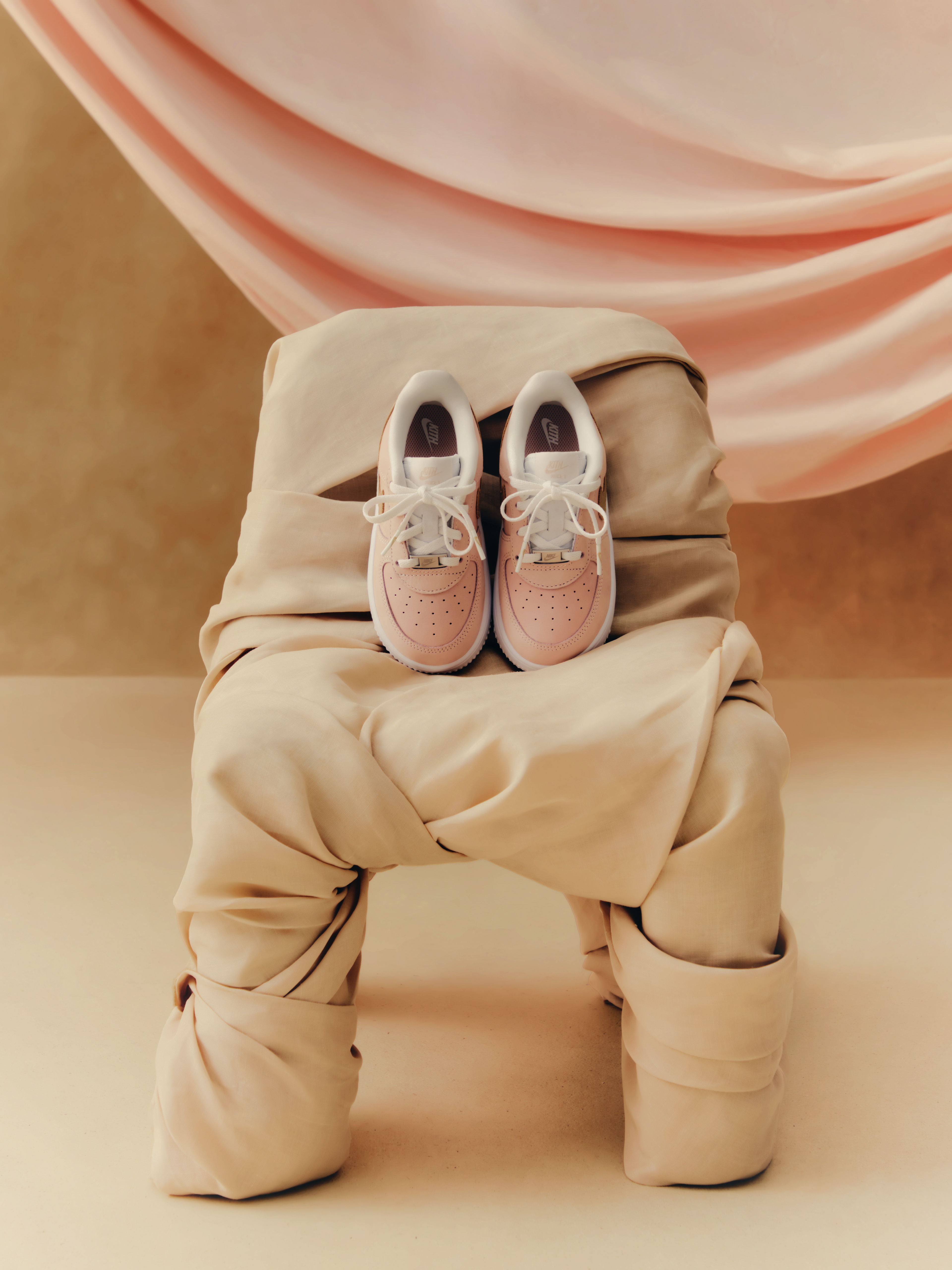 Nike Linen Pastel sneakers sportswear product shoot on fabric — commercial photography by Mason Maengkom, NYC