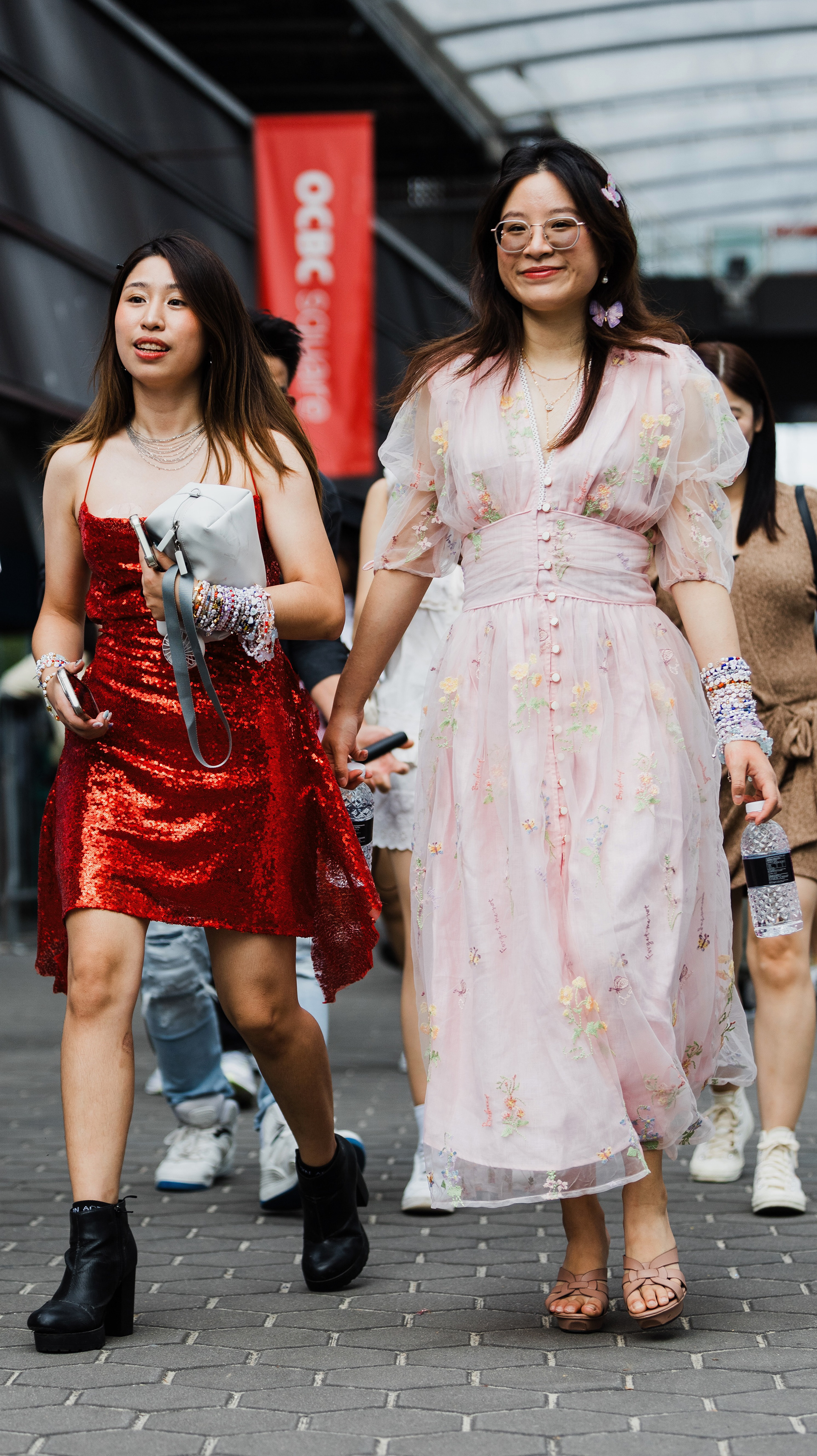 Environmental study of artisanal fan fashion. Capturing the intricate patterns and narrative textures of a DIY 'Reputation' era outfit. A key frame of individual expression.