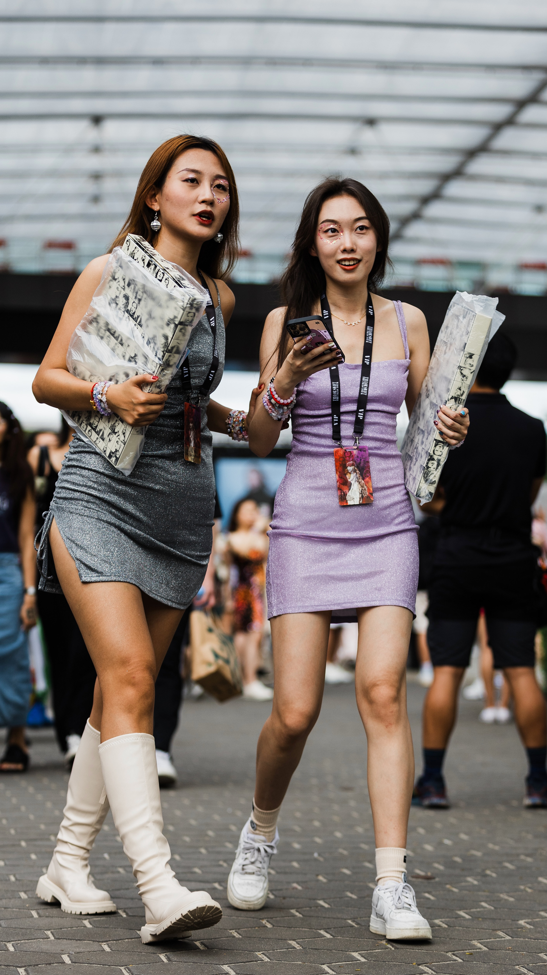 Persona extraction in pastel pink 'Lover' aesthetic. Utilizing the 135mm surgical gaze to isolate soft textures against the hard infrastructure of the stadium environment.