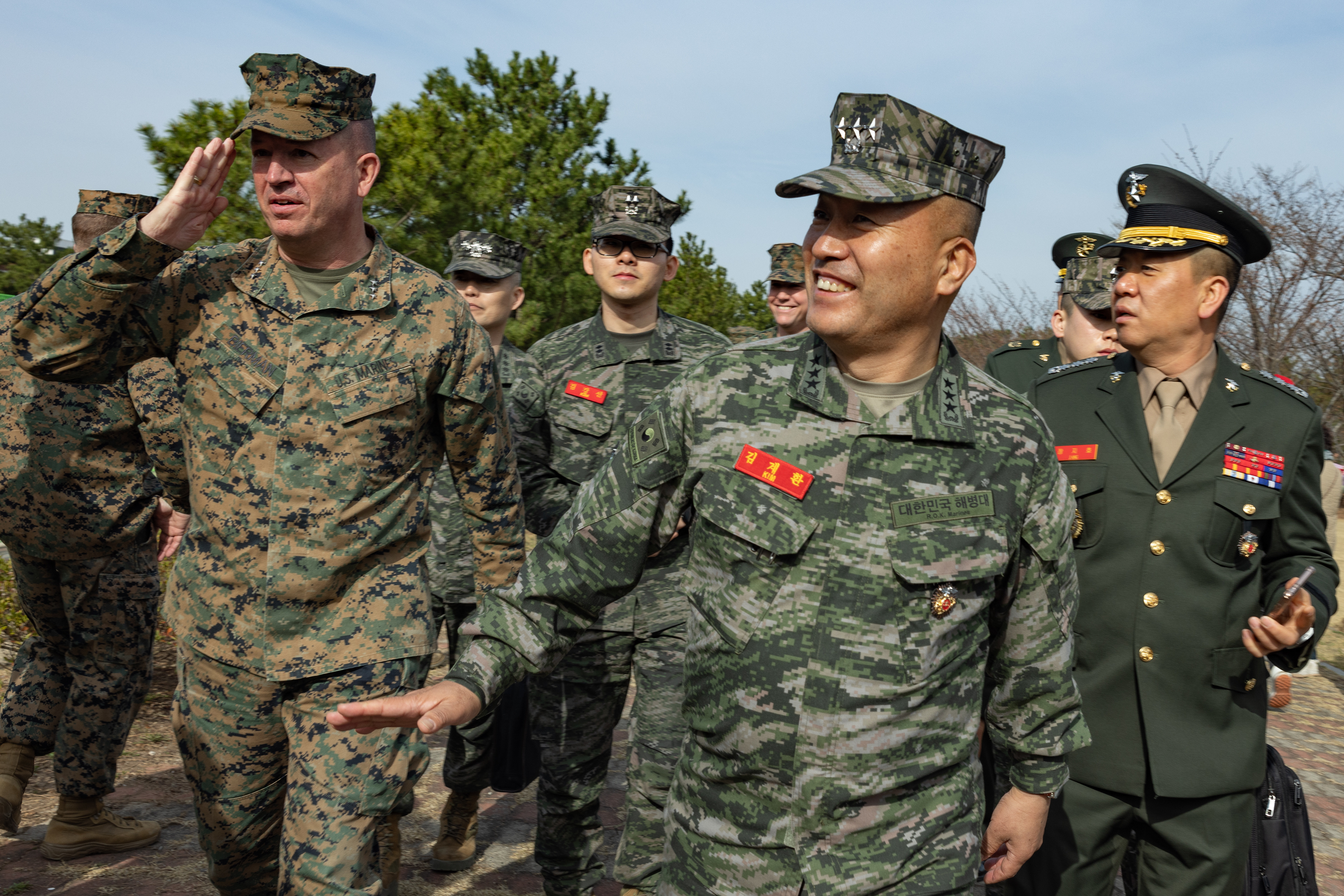Republic of Korea Marine Corps Commandant Lt. Gen. Kim Kye-Hwan, center, and U.S. Marine Corps Lt. Gen. James W. Bierman, commanding general of III Marine Expeditionary Force, left, tour the training area at the Education and Training Group on March 16, 2023 in the Republic of Korea.