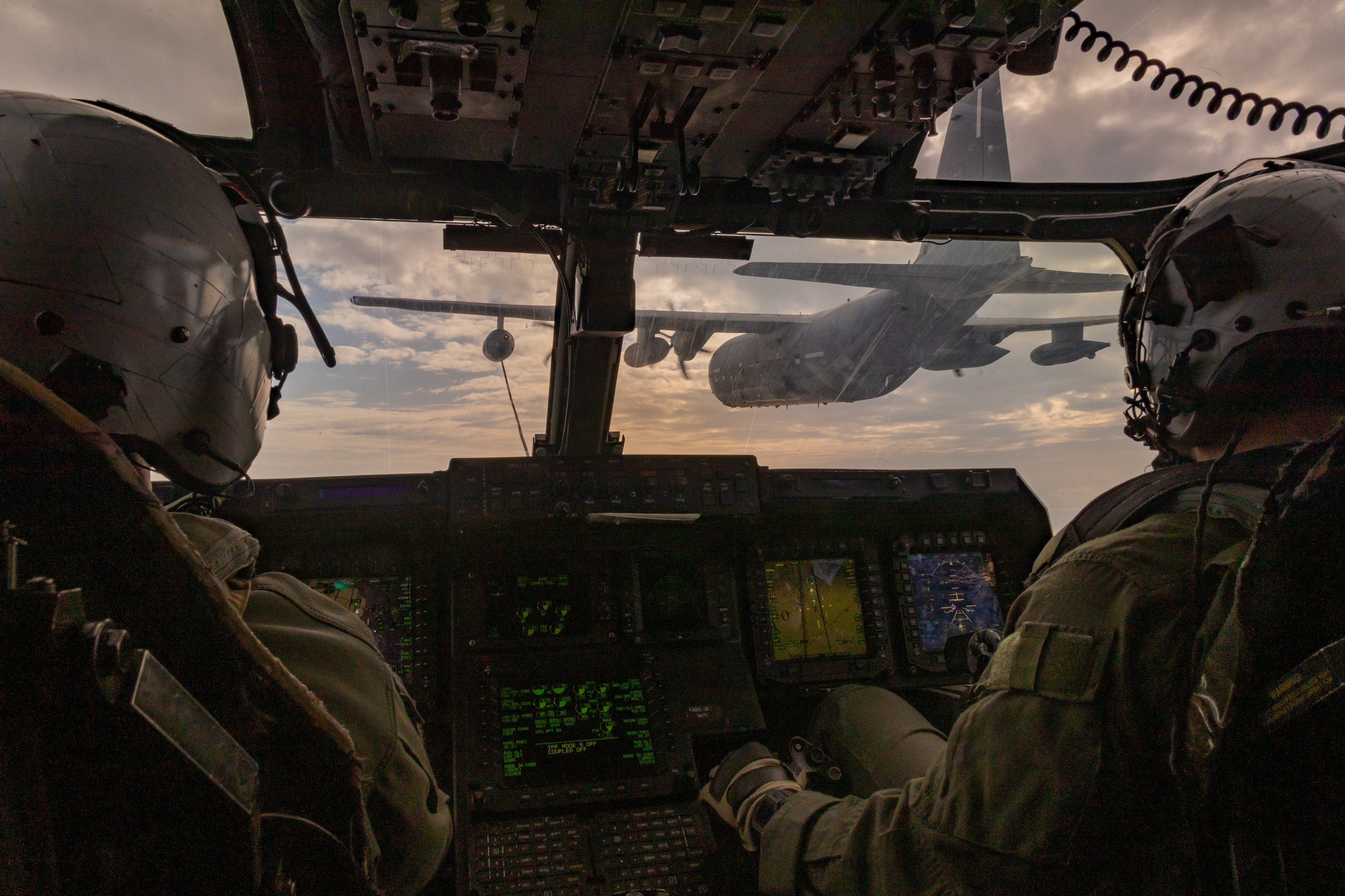 U.S. Marine Corps pilots with Marine Medium Tiltrotor Squadron (VMM) 262 (Rein.), 31st Marine Expeditionary Unit, receive a refuel in an MV-22B Osprey assigned to VMM-262 (Rein.) from a C-130H, during aerial refuel operations in support of Iron Fist 25 on Feb. 21, 2025 off the coast of Japan.