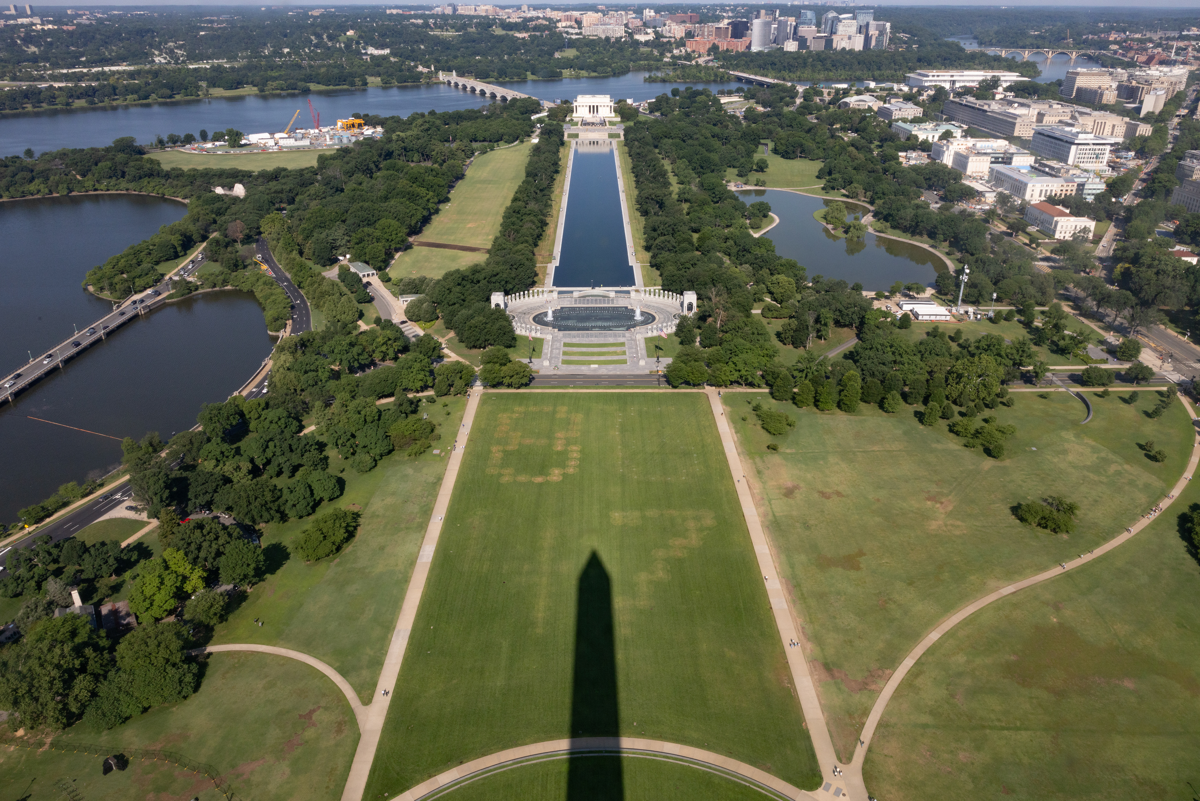 An elevated perspective from atop the Washington Monument shows the term 8647 vandalized in the grass along the National Mall on June 12, 2026 in Washington, D.C. (Photo by Tyler M. Andrews/The Washington Post)