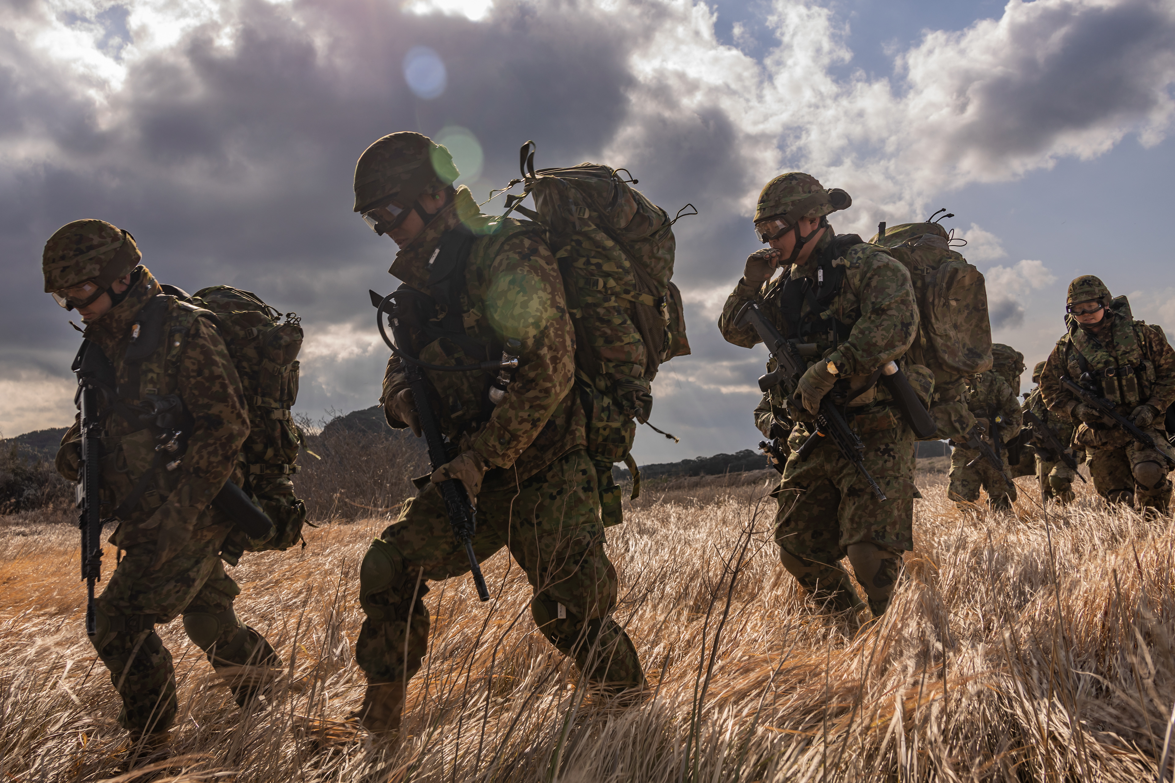 Japan Ground Self-Defense Force members with 1st Amphibious Rapid Deployment Regiment, prepare to embark a U.S. Marine Corps MV-22B Osprey assigned to Marine Medium Tiltrotor Squadron (VMM) 262 (Rein.), 31st Marine Expeditionary Unit, during a bilateral insert exercise in support of Iron Fist 25 at JGSDF Camp Ainoura on Feb. 23, 2025 in Nagasaki, Japan.