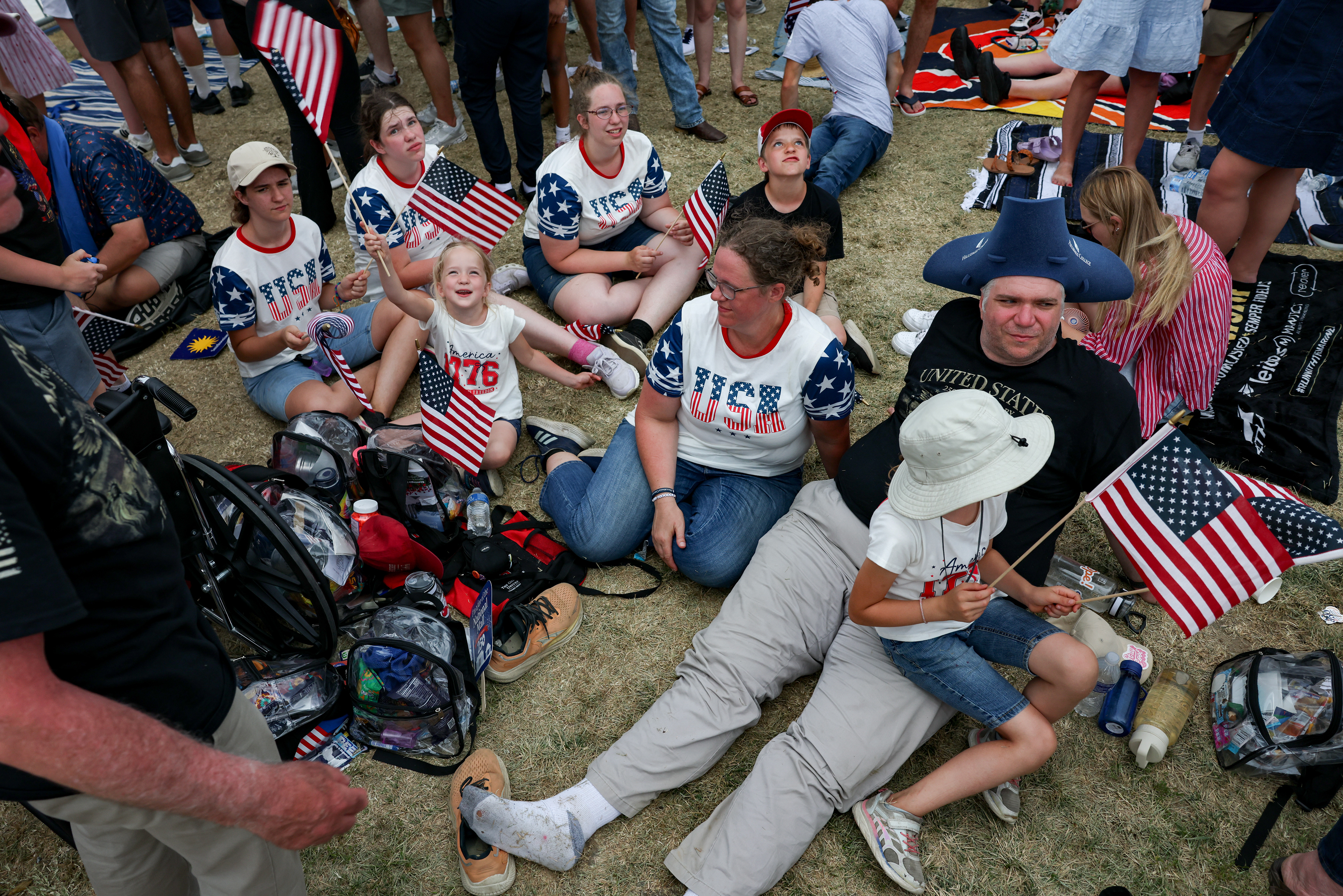 Rebecca Brodegard, center, and Jon Brodegard, right, sit on the National Mall with their children ahead of the ‘Salute For America’ event on July 4, 2026 in Washington, D.C. (Photo by Tyler M. Andrews/The Washington Post)