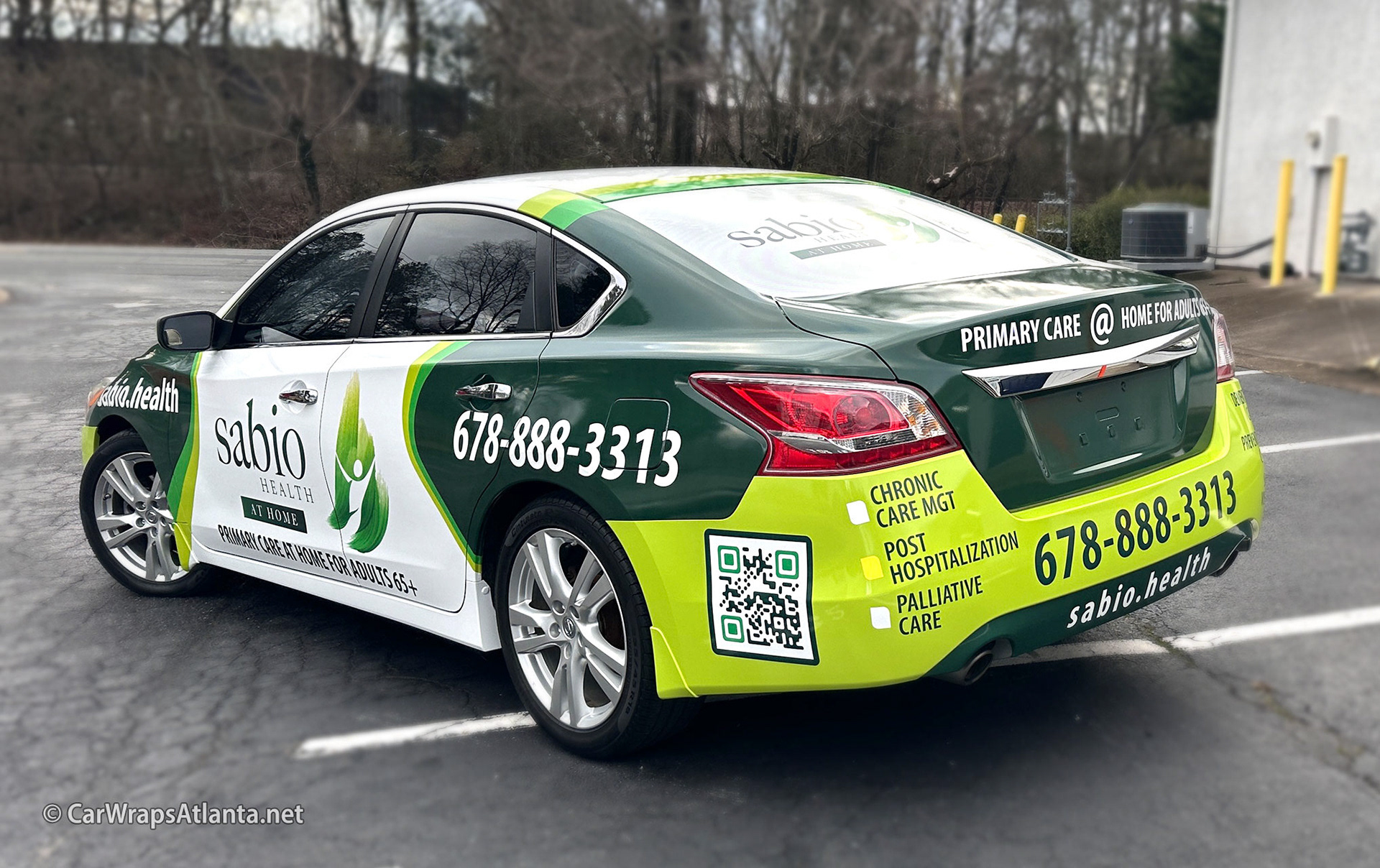 Close-up of the Sabio Health logo and custom messaging on the full Nissan Altima wrap.