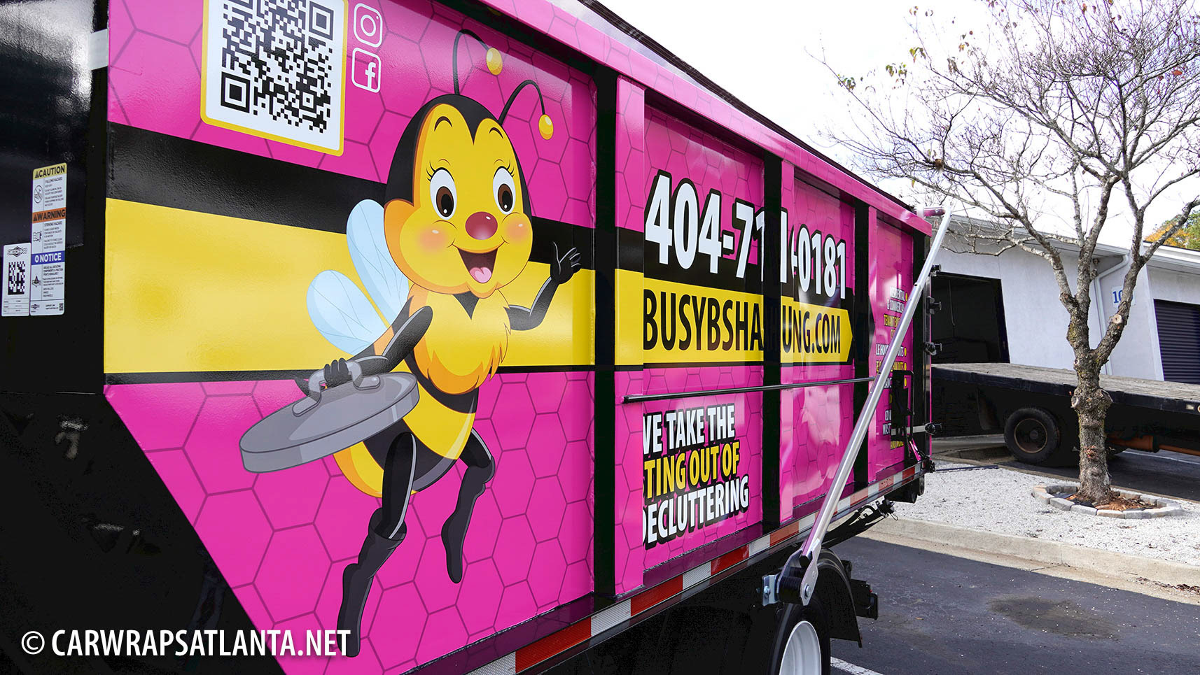 Detailed image of the precision vinyl alignment during the Isuzu Truck wrap installation.