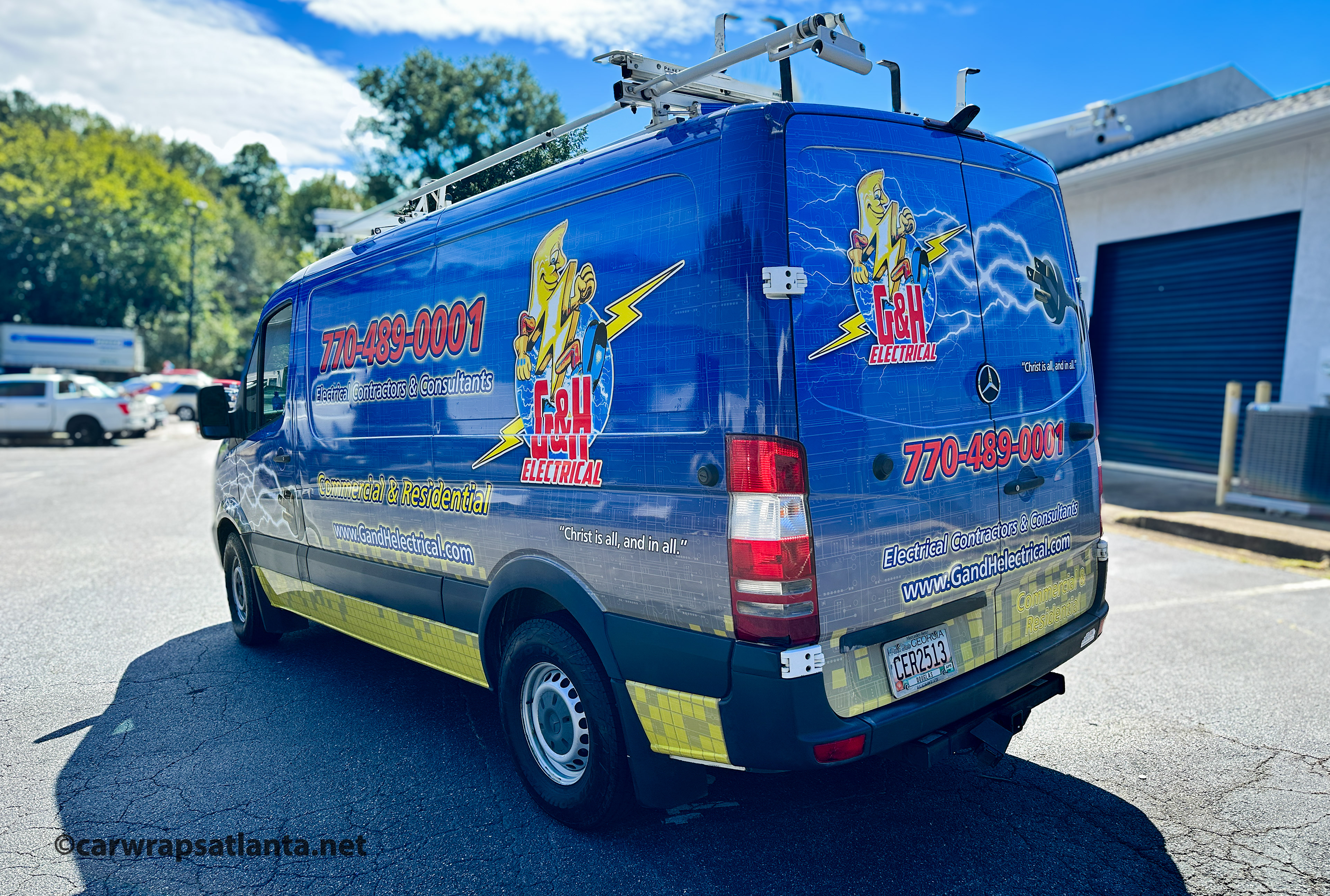 Full side view of the wrapped Mercedes-Benz Sprinter demonstrating high visibility for the electrical company.