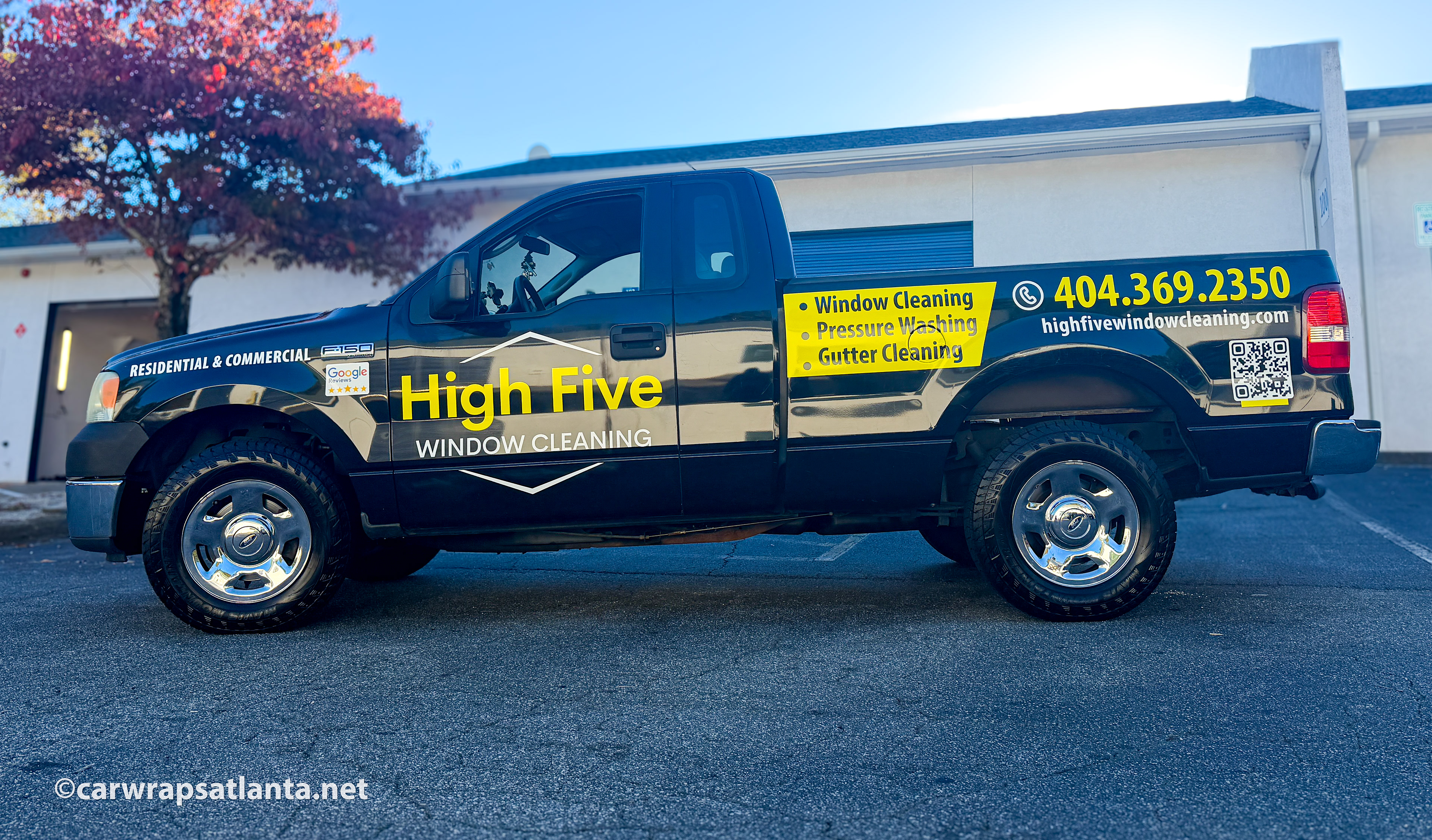 Hero image: Custom spot graphics applied to a Ford F150 truck for a professional window cleaning company in Atlanta, GA.