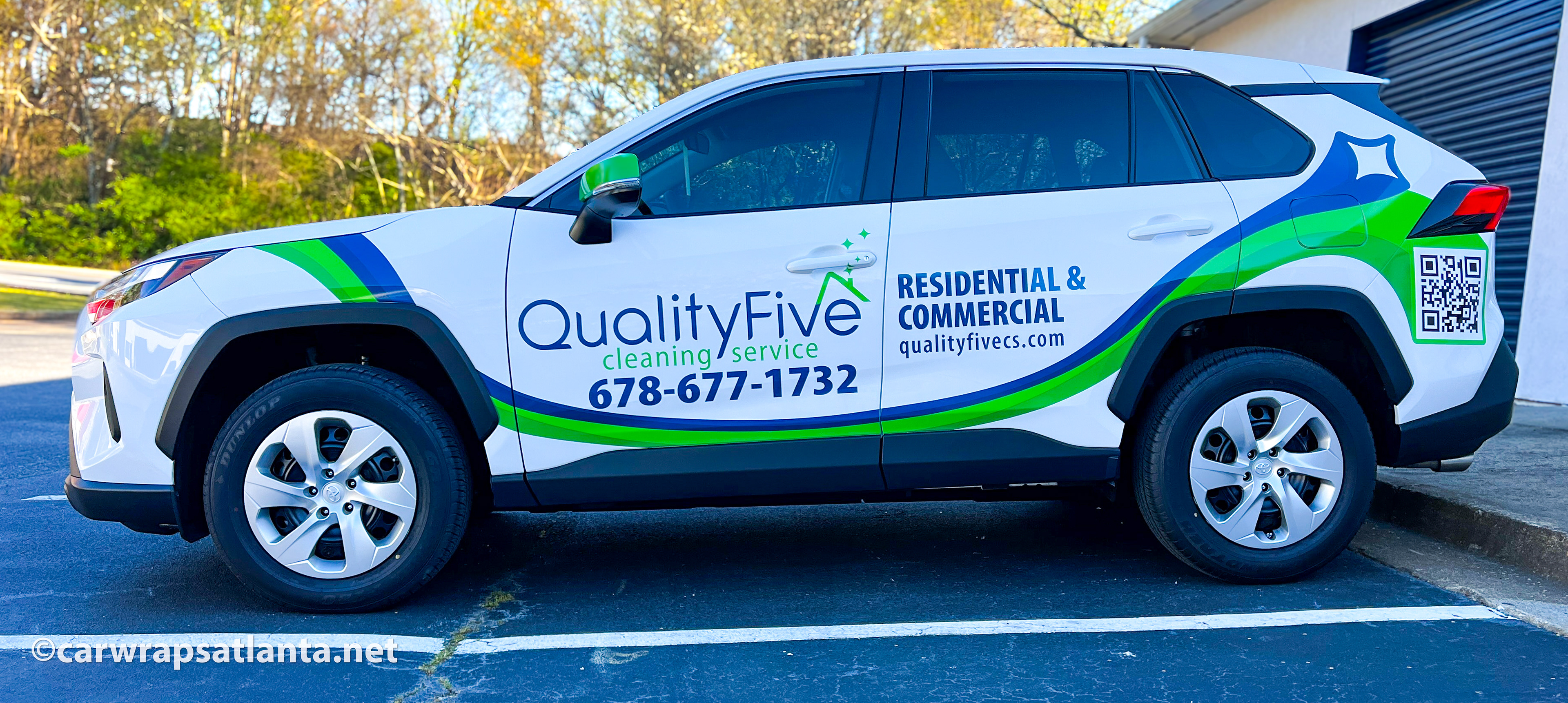 Hero image: Custom spot graphics and branding on a Toyota RAV4 SUV for a cleaning service company in Cumming, GA.