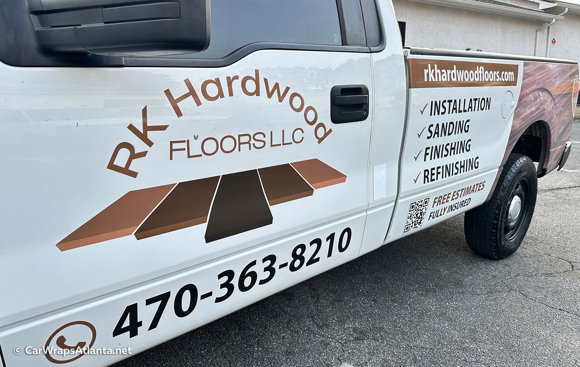 Custom Ford F-150 partial wrap promoting flooring services with high-impact fleet branding