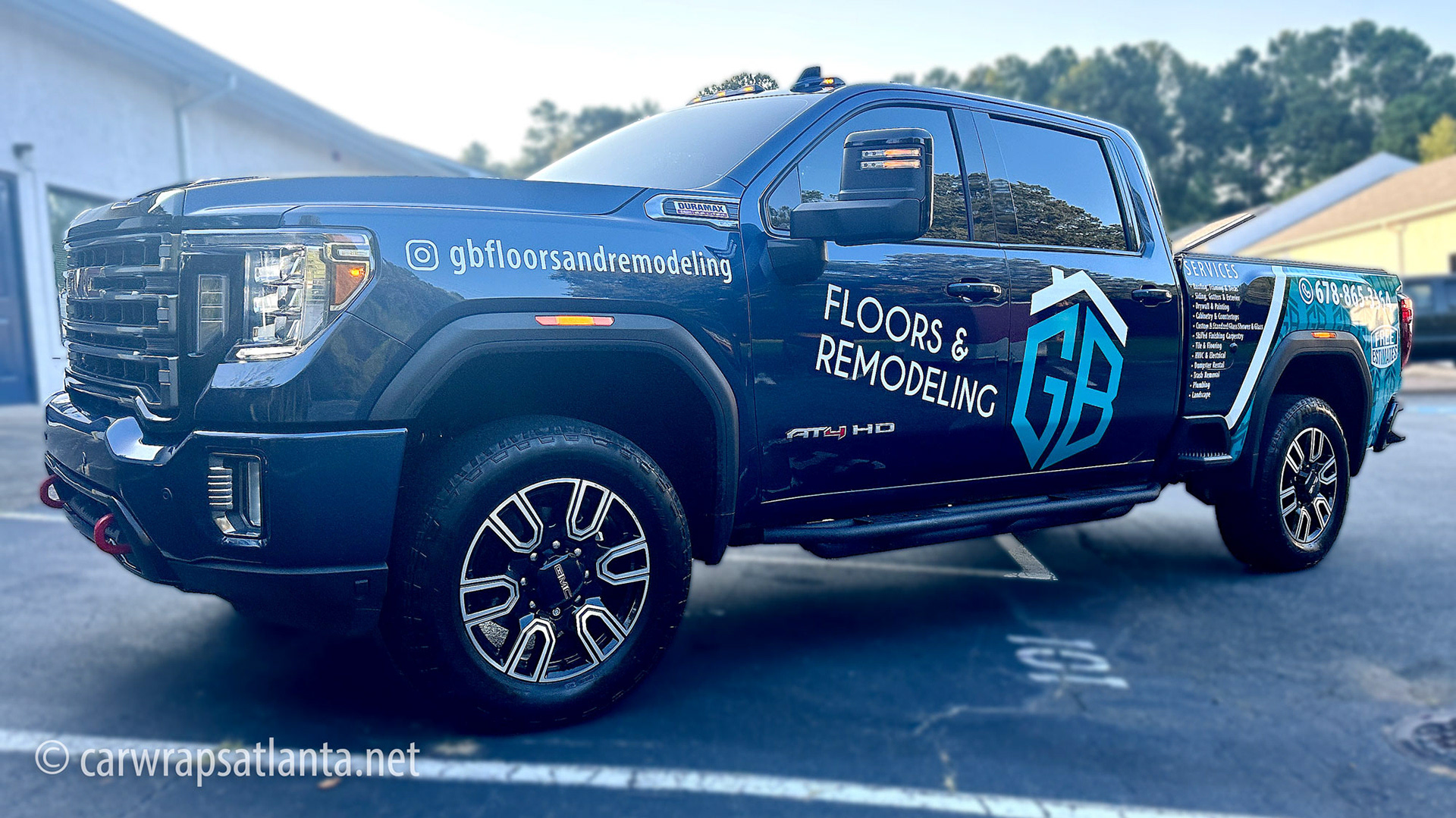 Partial commercial wrap on a GMC Sierra truck and enclosed trailer for a flooring company in Atlanta.