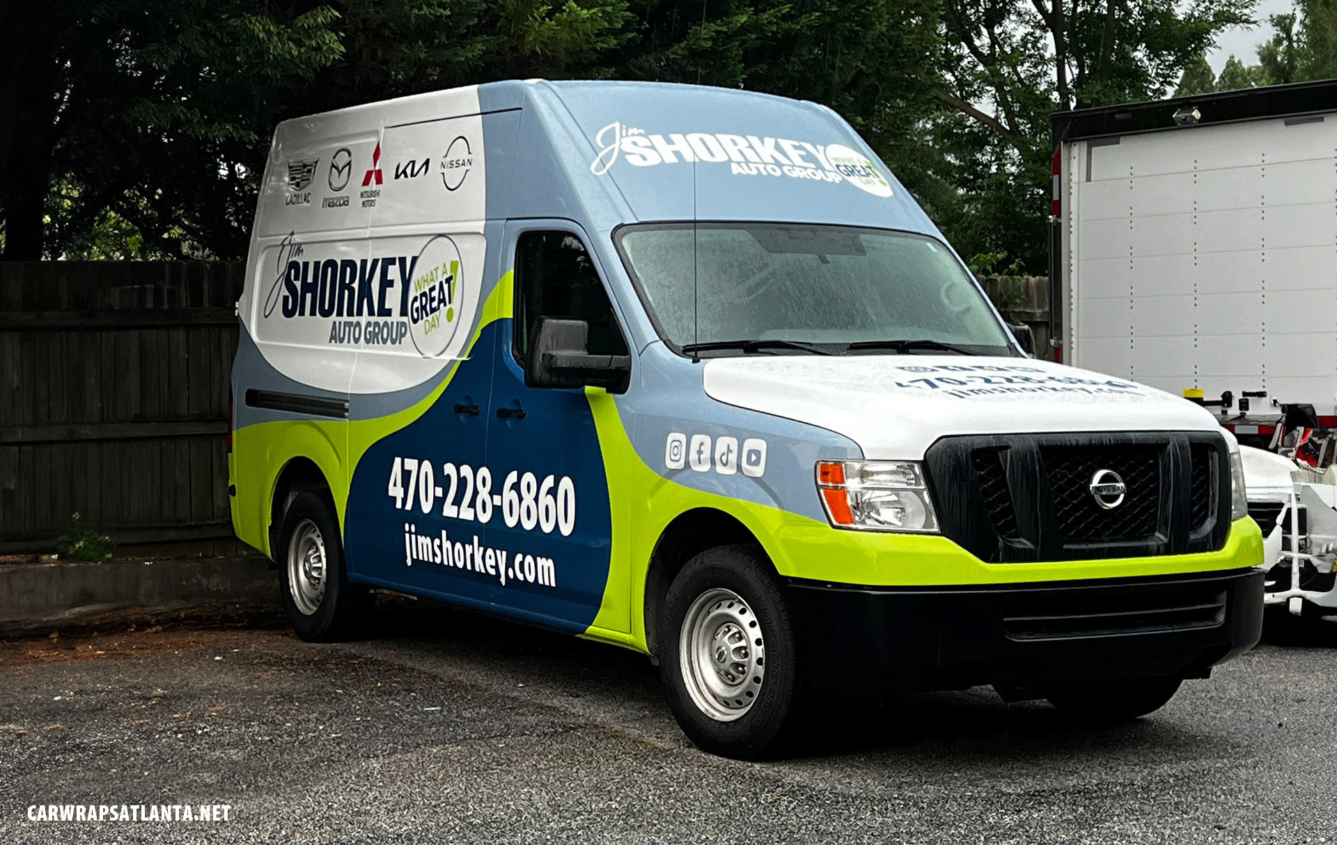 \Close-up of high-quality graphics and logo on the Jim Shorkey Auto Group full van wrap.