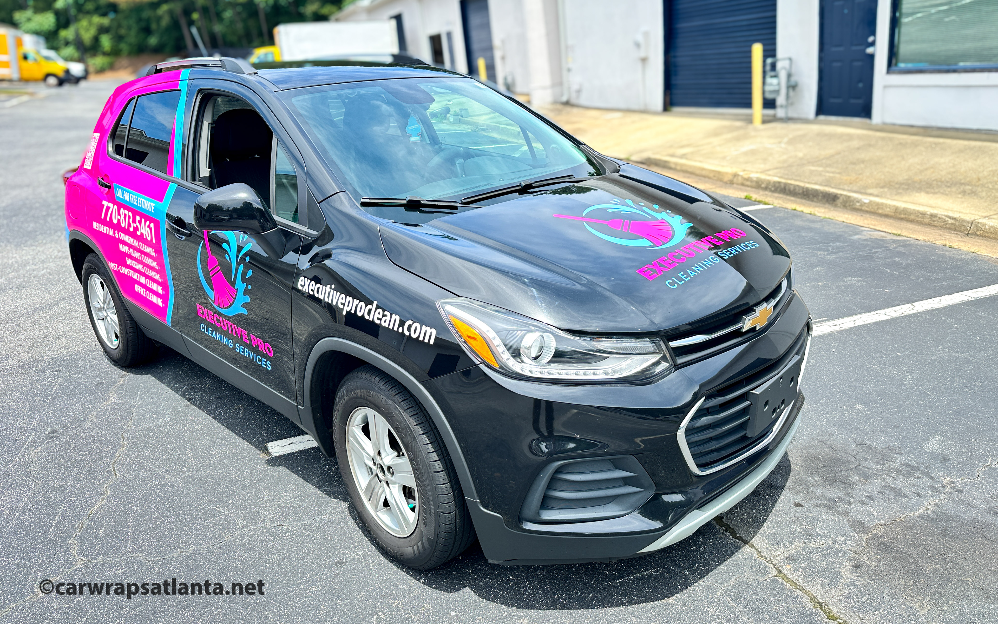 In-progress photo showing the professional installation process of the partial wrap on the Chevrolet Trax.