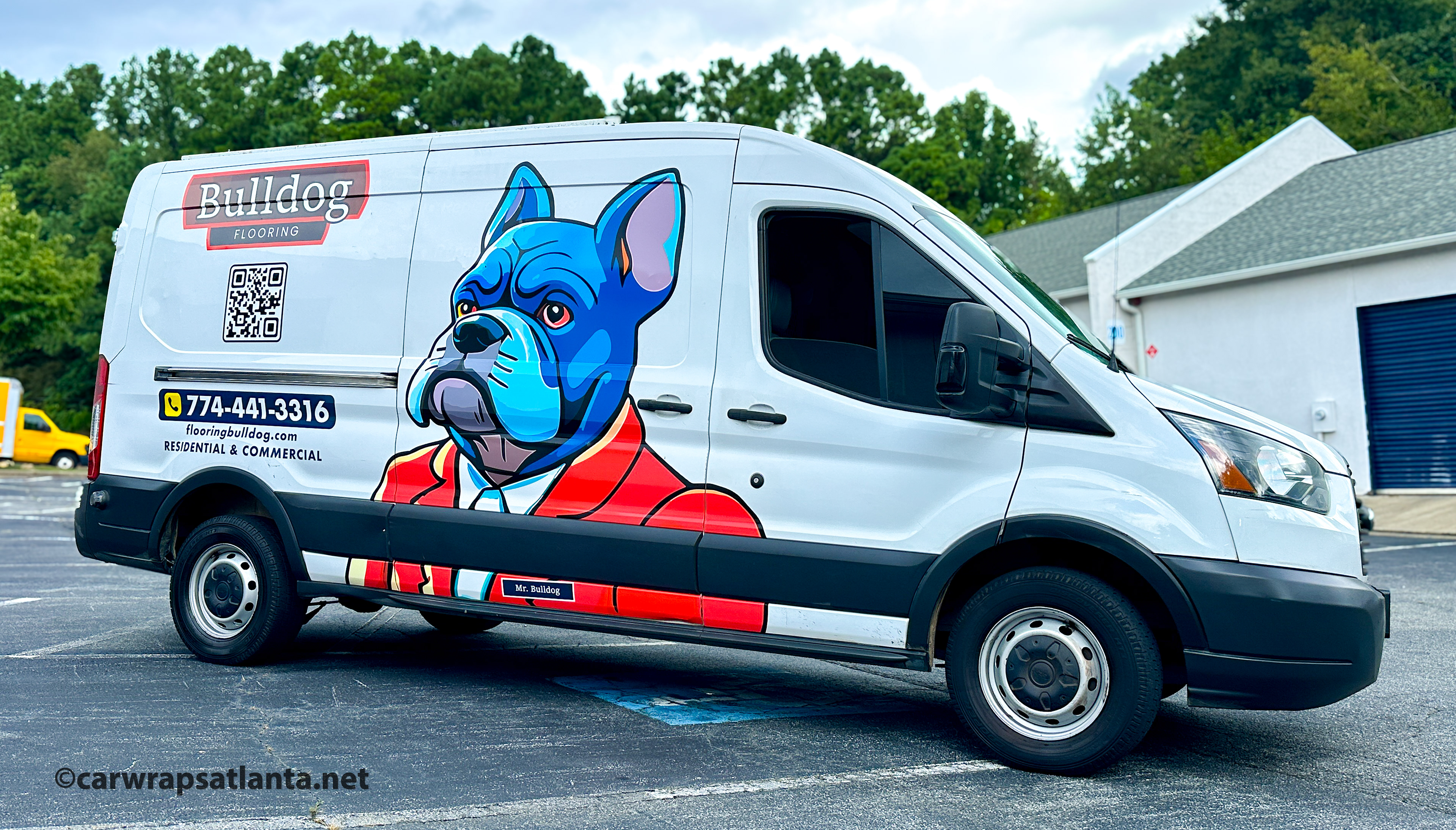 Close-up of the flooring company's professional logo and graphic elements on the Ford Transit partial wrap.