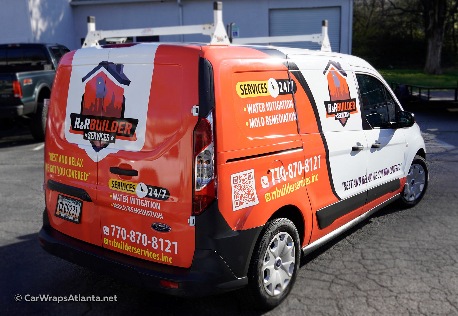 Custom partial wrap on the Ford Transit Connect parked in a commercial setting near Lawrenceville, GA.