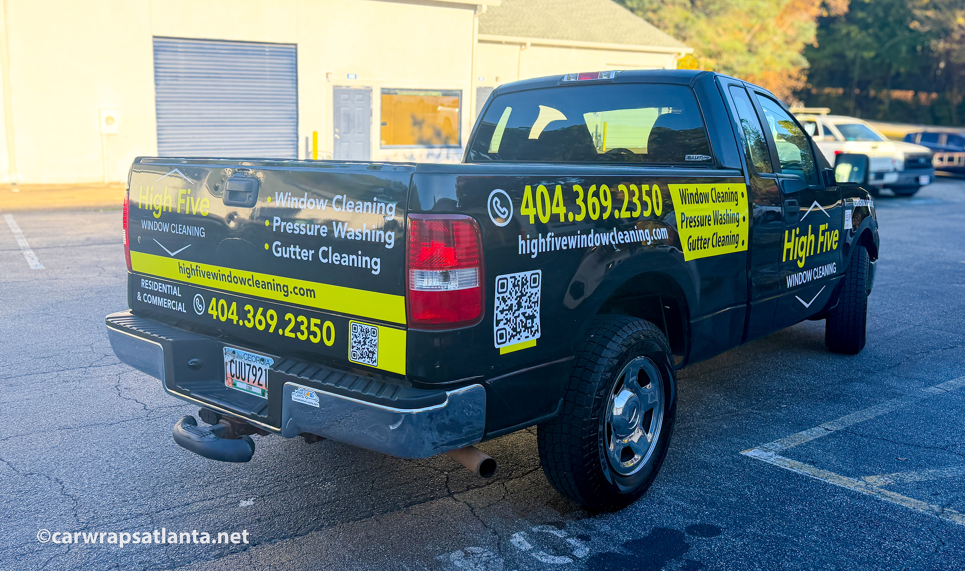Close-up of the window cleaning company's logo and service details on the Ford F150 spot graphics.
