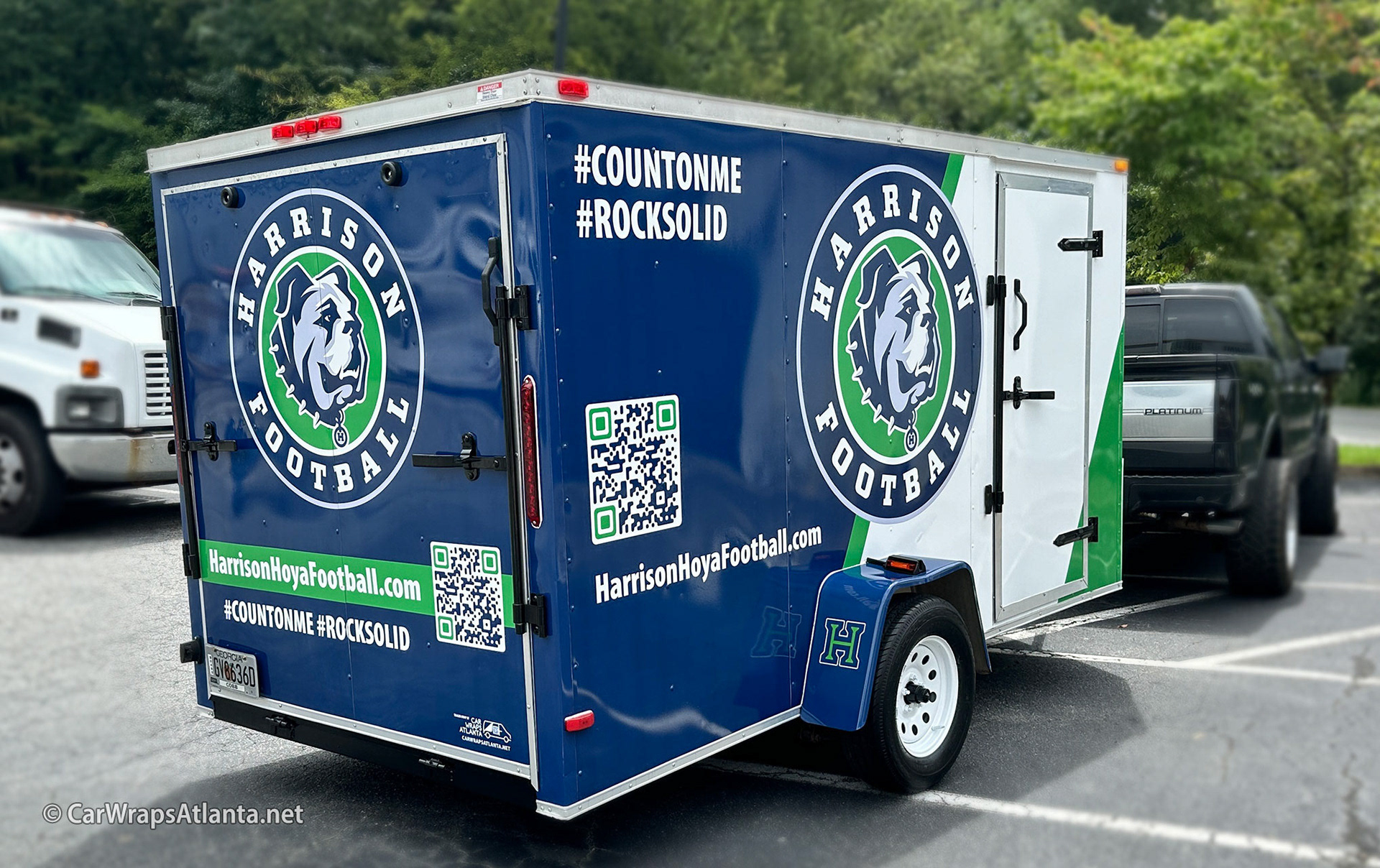 Close-up of mascot and logo graphics on the durable full trailer wrap material.