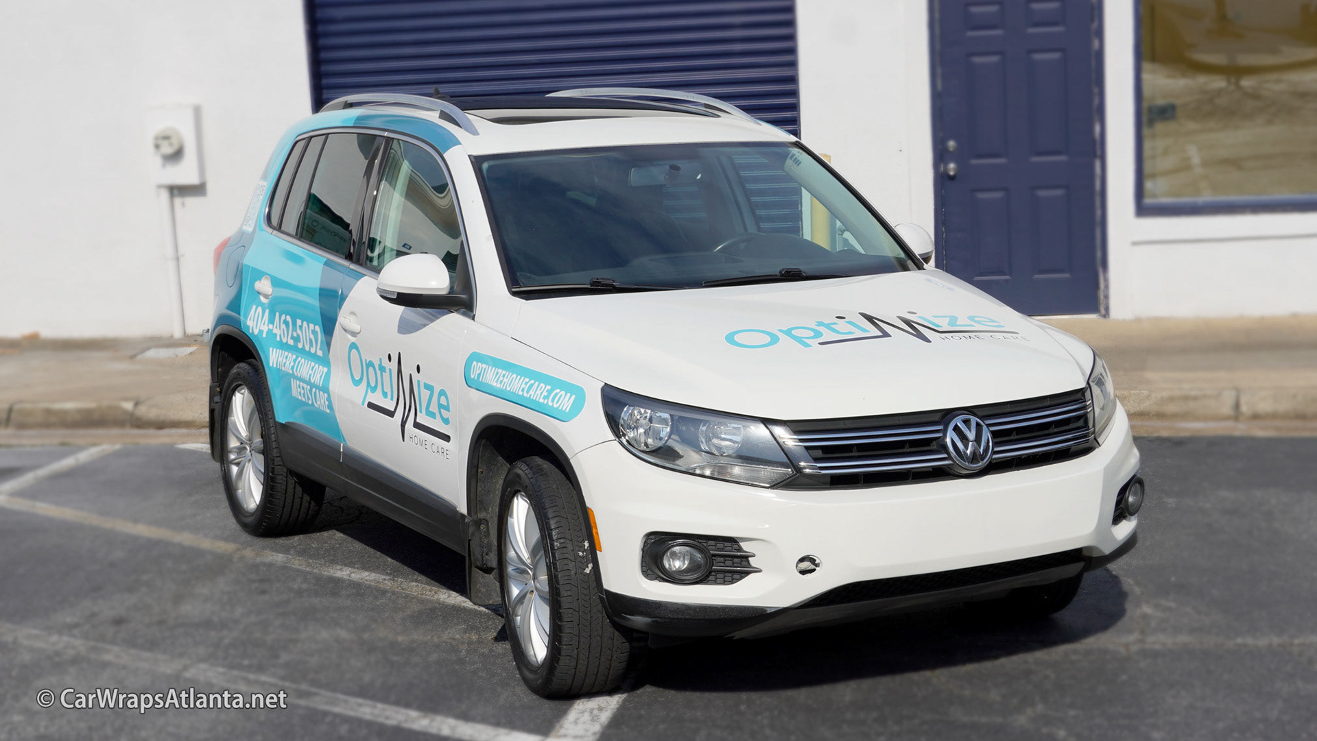 Side view of the partial wrap on the VW Tiguan showcasing maximum brand visibility in Atlanta.