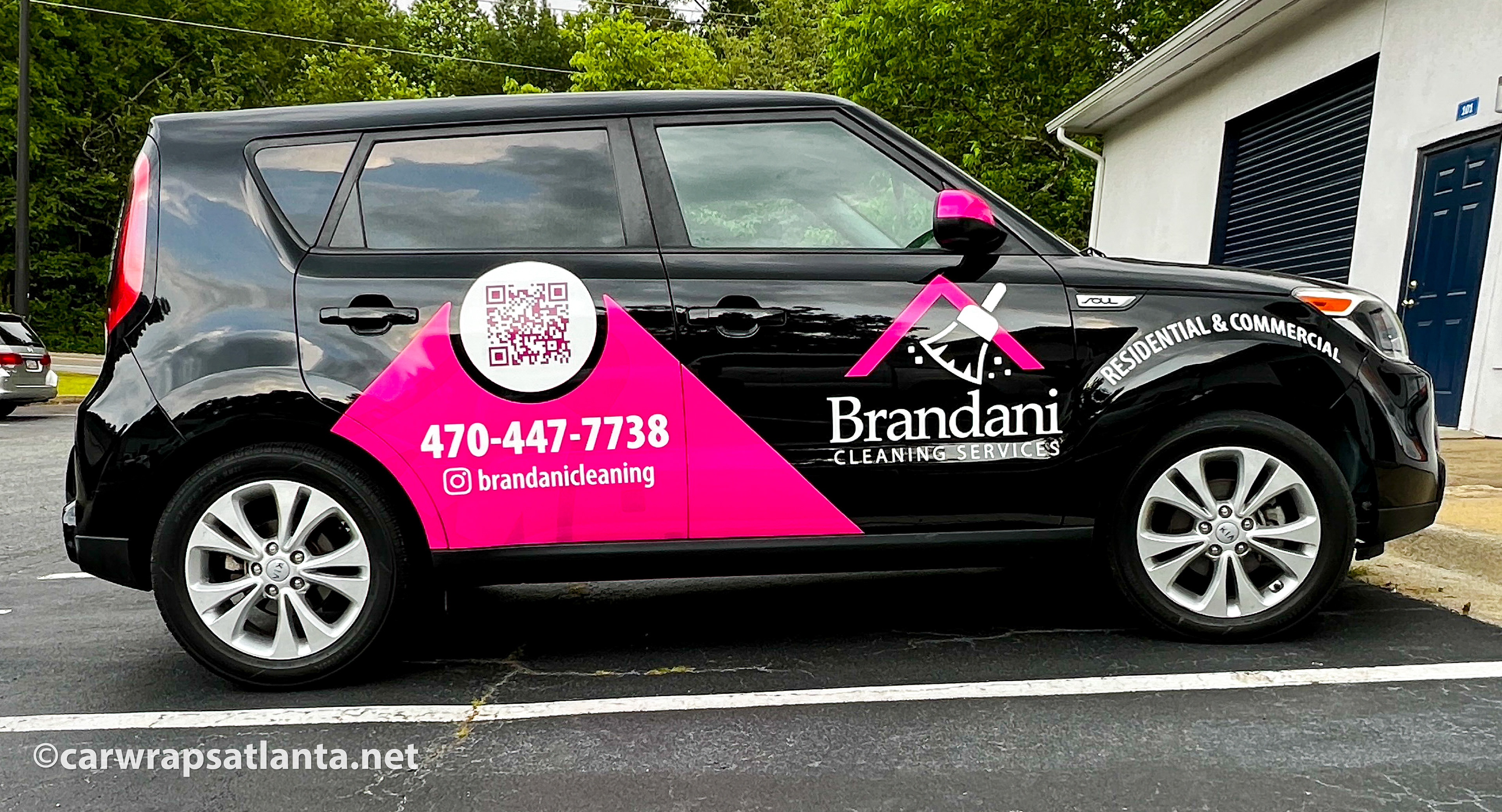 Hero image: Custom spot graphics applied to a Kia Soul SUV for a cleaning service company in Atlanta, GA.