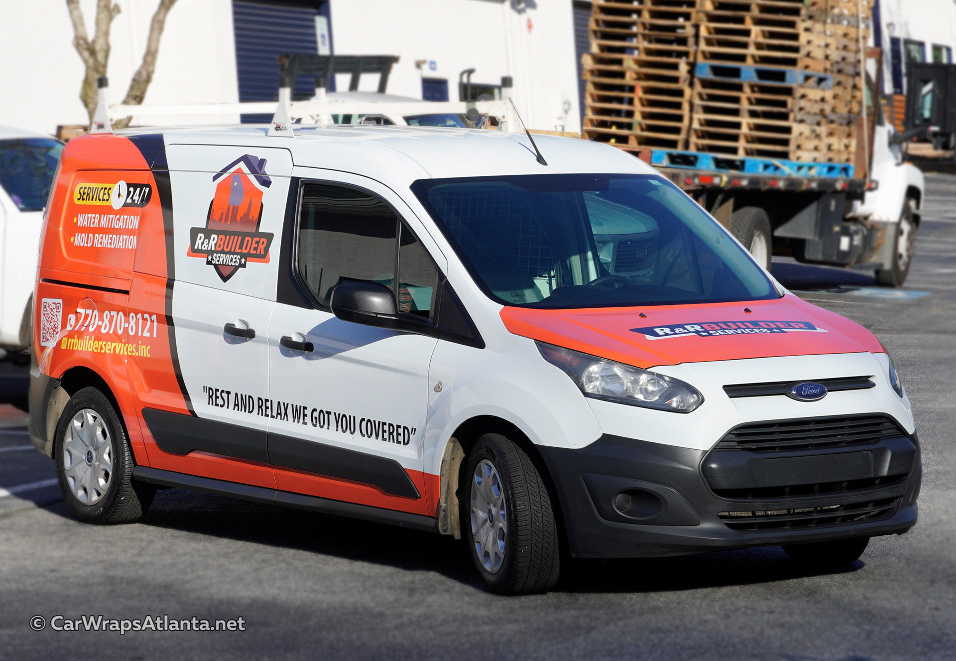 Close-up of the professional logo and high-quality graphics detail on the Ford Transit Connect partial wrap.