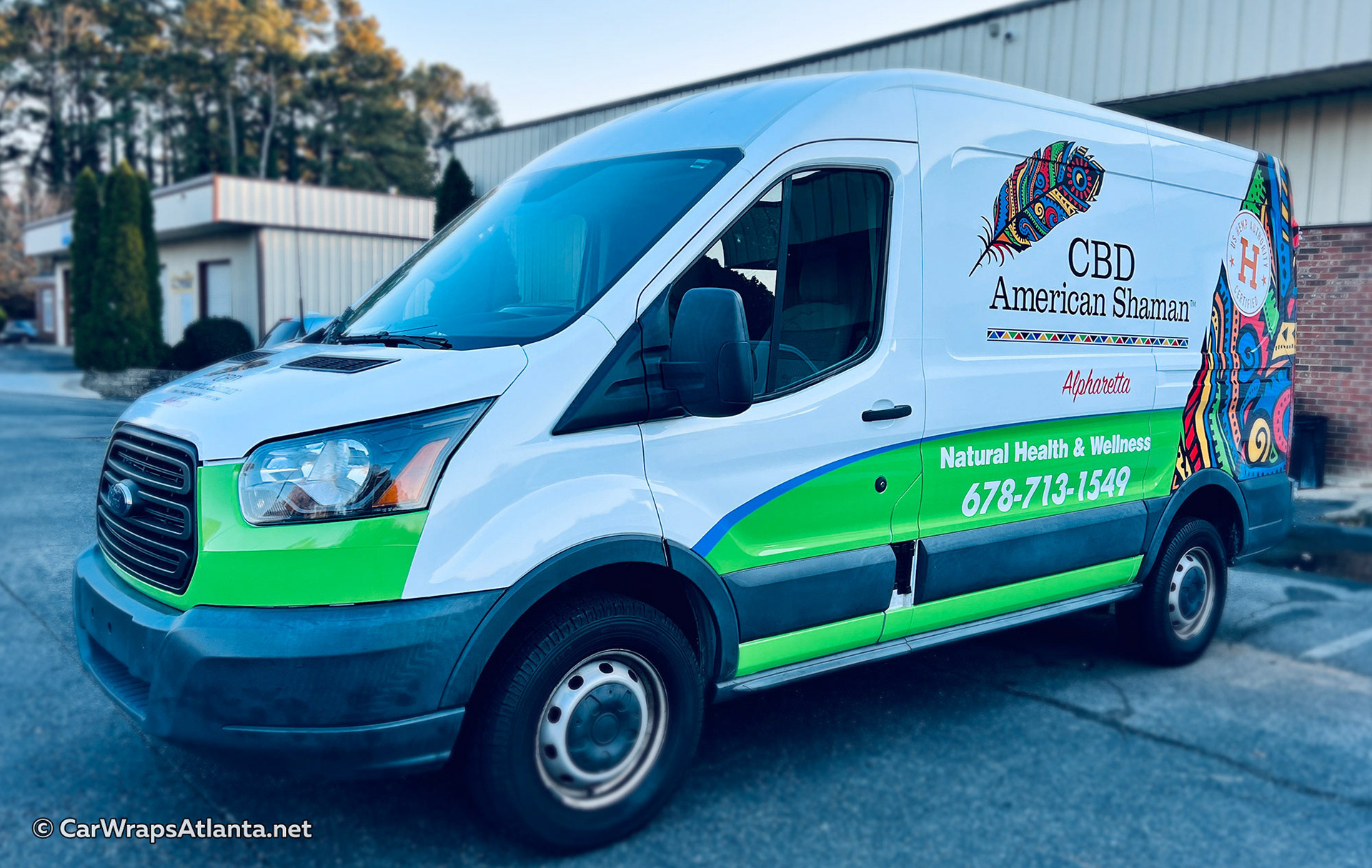 Close-up of CBD American Shaman logo and hemp graphics on the full Ford Transit wrap.