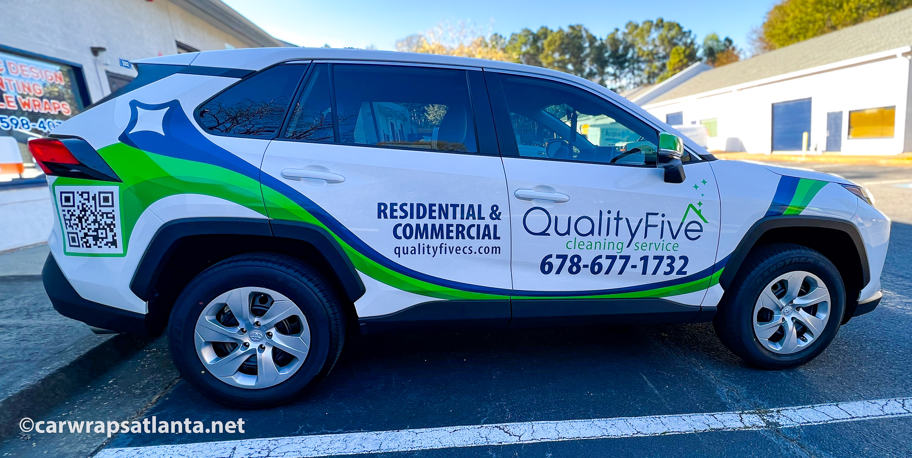 Close-up of the cleaning service logo and clear graphics applied to the Toyota RAV4 spot graphics.