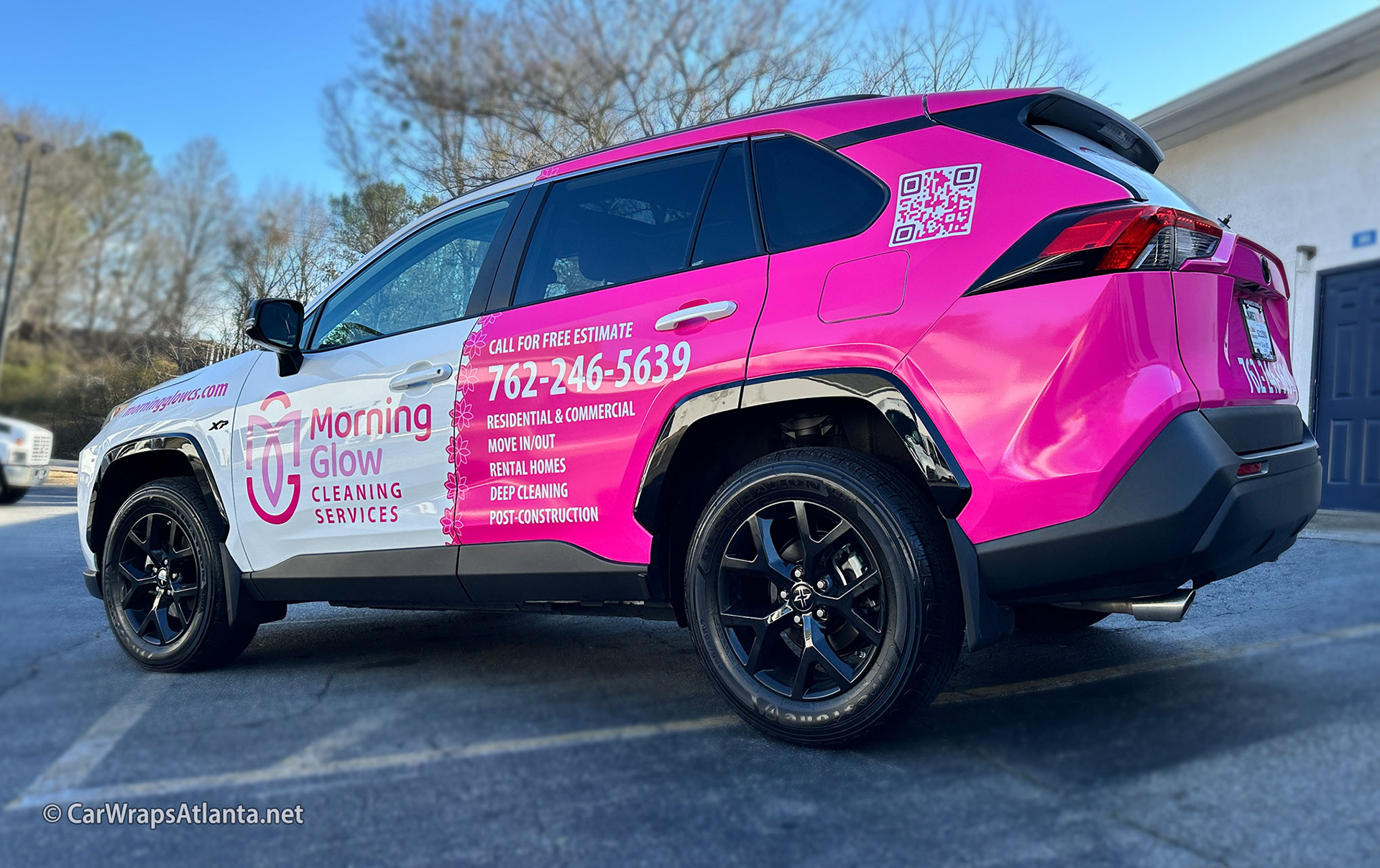 The rear of the Toyota RAV4 with the Morning Glow Cleaning Services partial wrap, displaying a clean and polished finish with a call-to-action and logo.