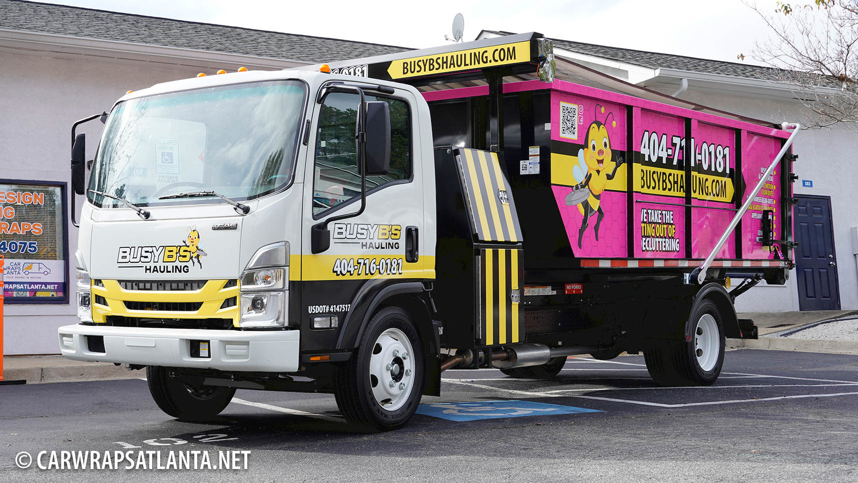 Close-up of the custom logo and graphics on the Isuzu Hauling Truck full wrap.