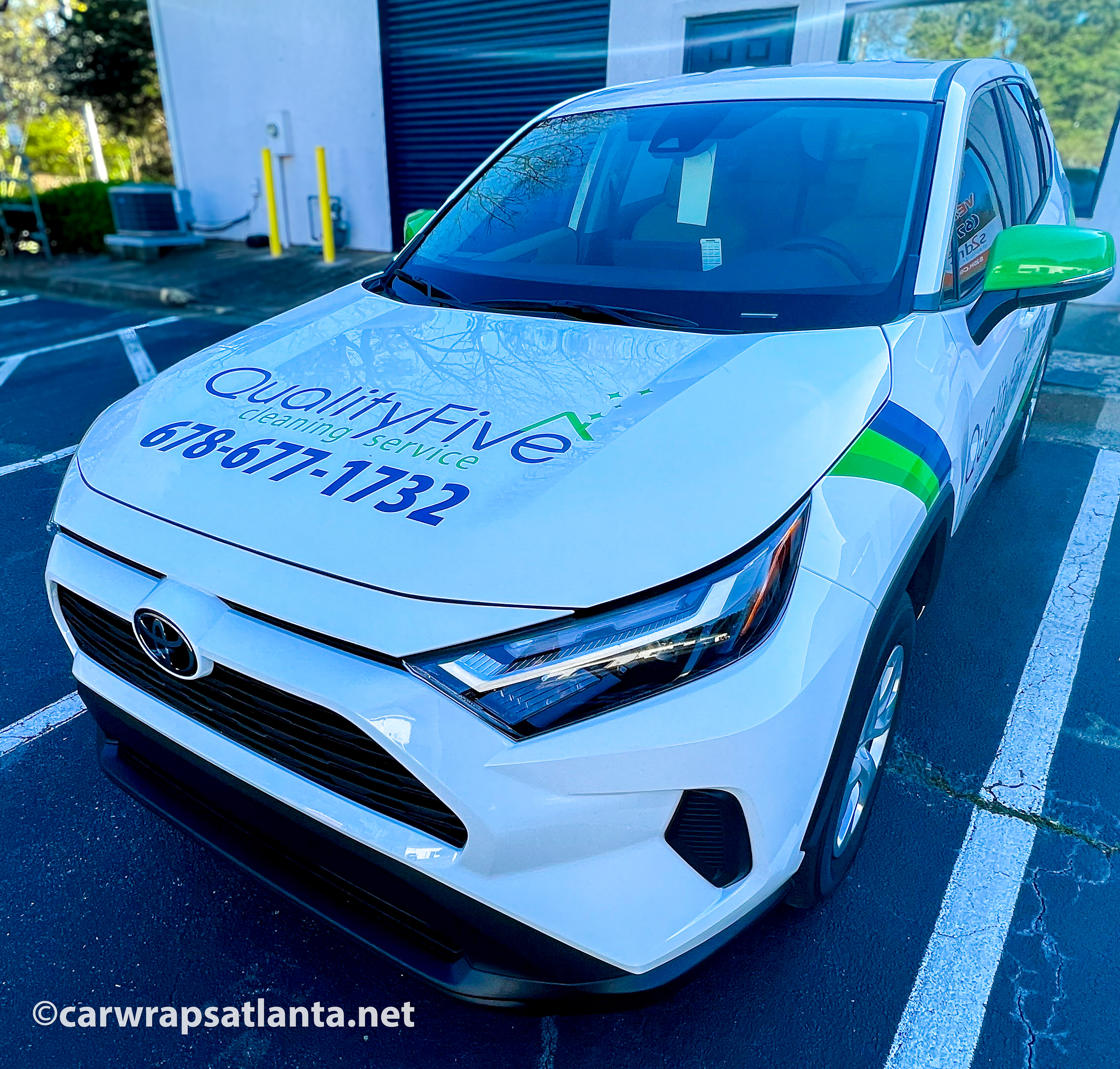 Front view of the Toyota RAV4 with spot graphics demonstrating effective cleaning service advertising in Cumming.