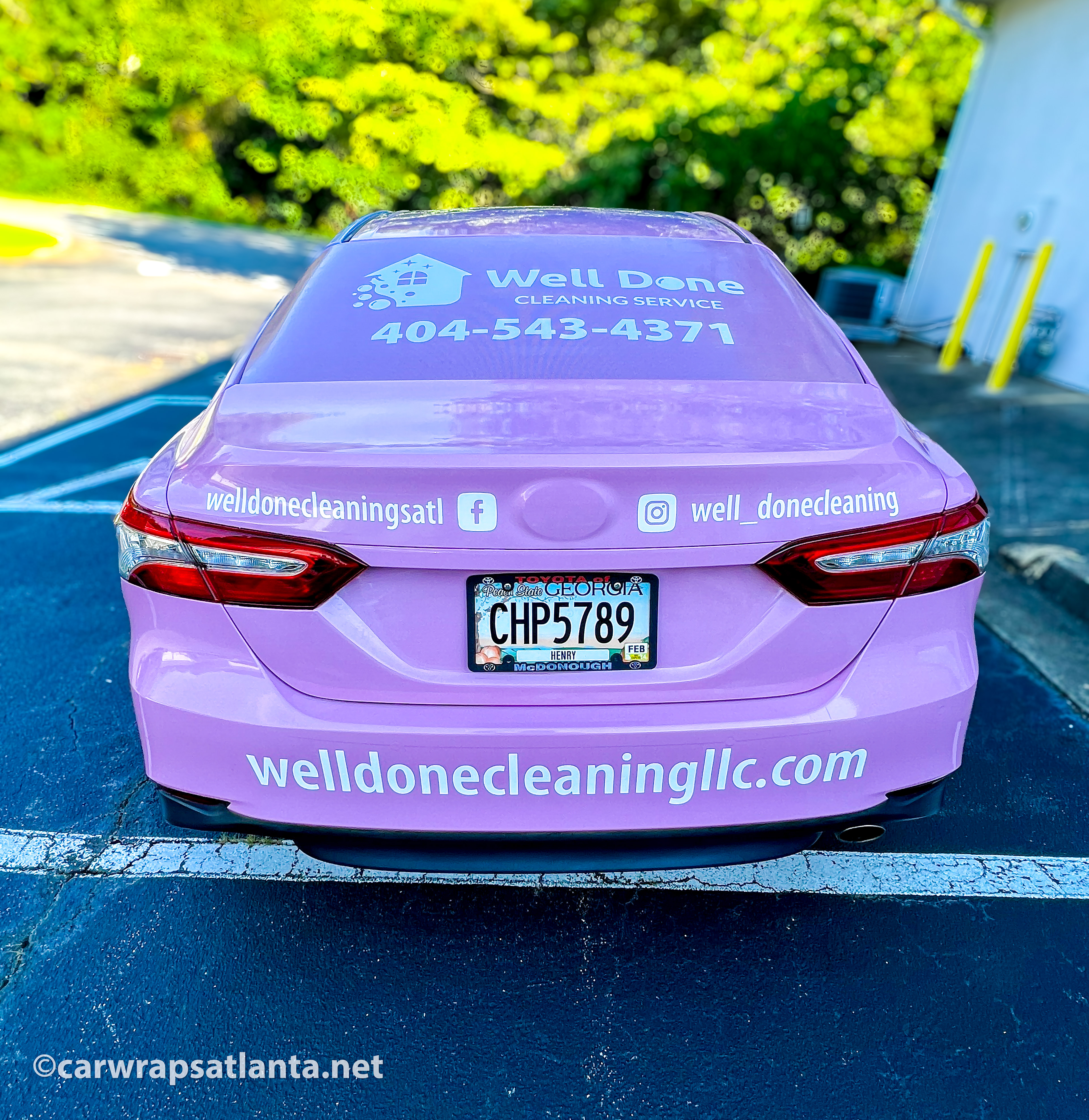 In-progress photo of the vinyl installation on the Toyota Camry full wrap.