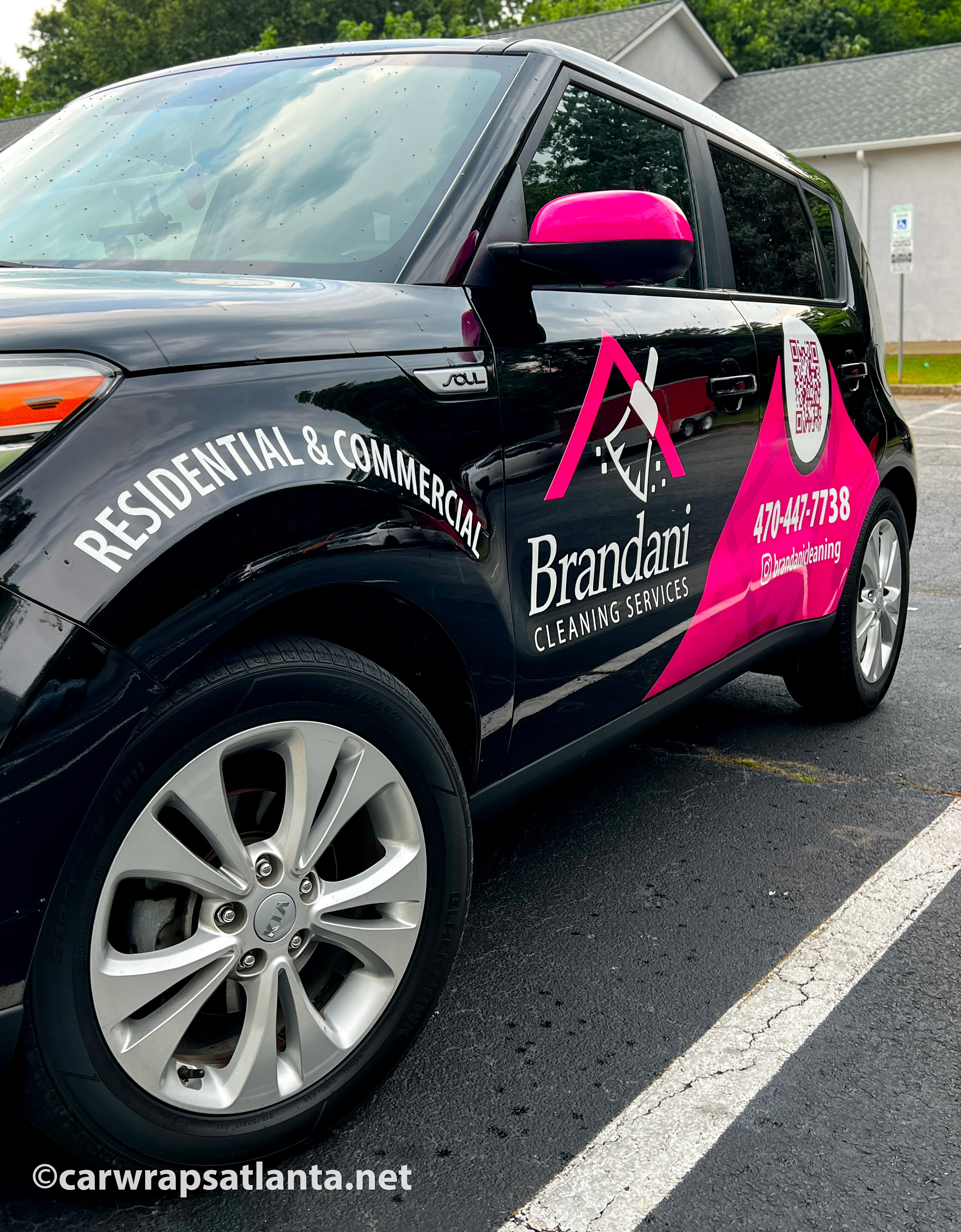Full side view of the Kia Soul with spot graphics demonstrating effective cleaning service advertising in Atlanta.
