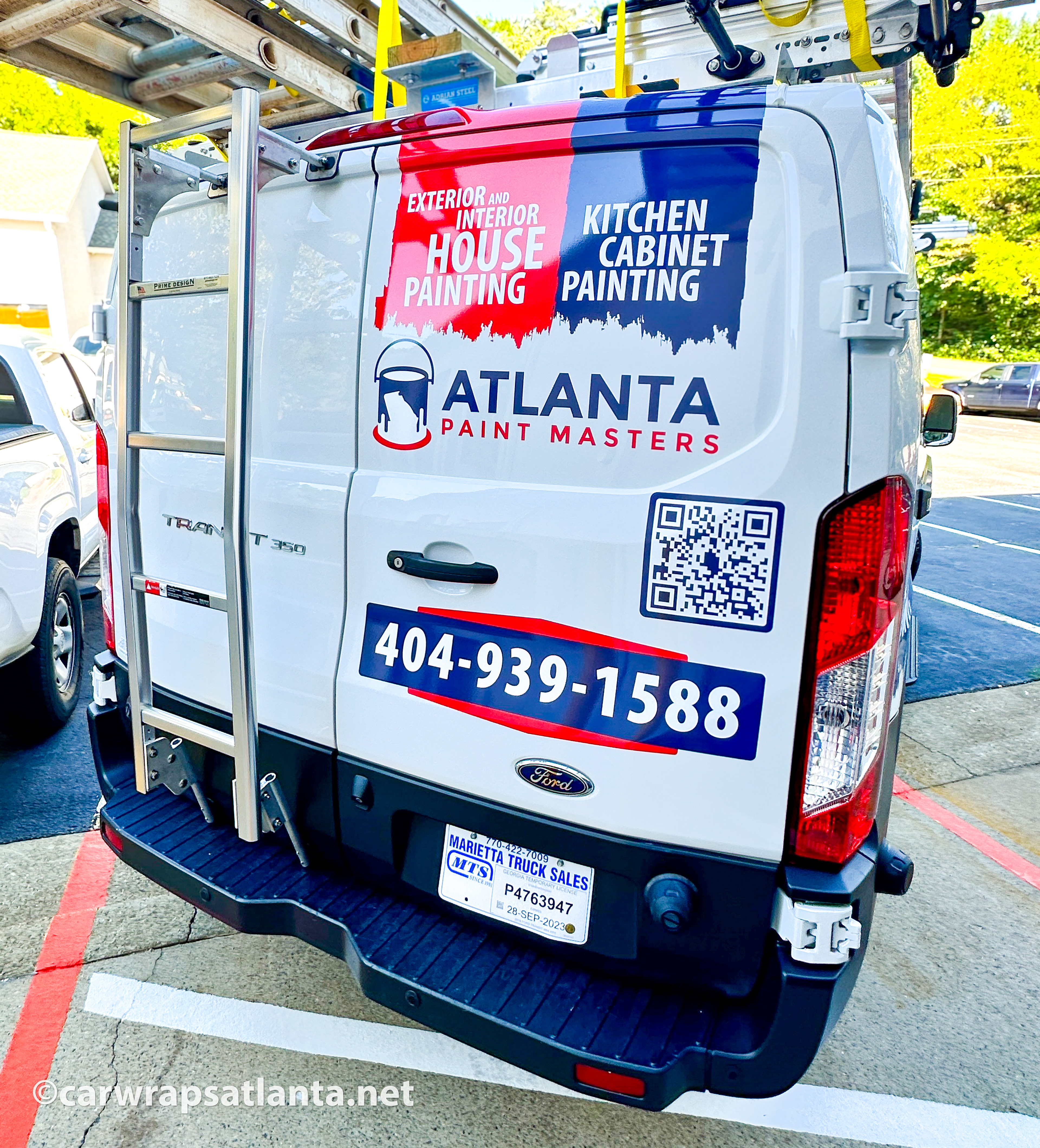 Close-up of the professional printing and precise cutting of the vinyl spot graphics for the painting company.